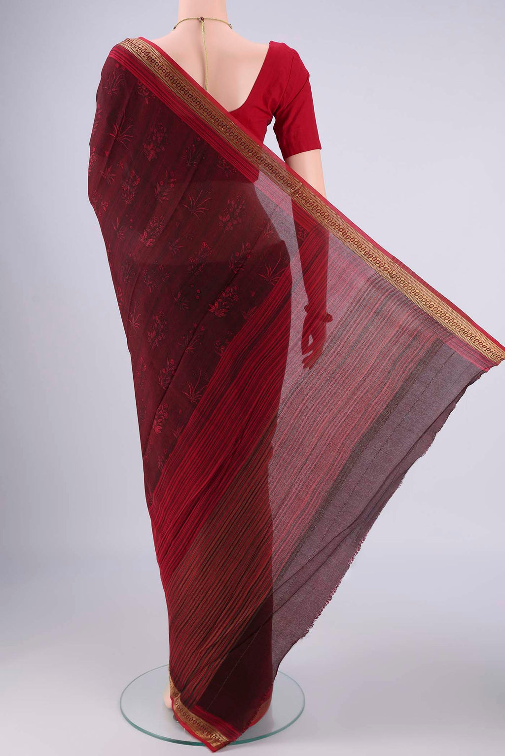 Flat view of Maroon Mysore Crepe Saree with Printed design on the body and Zari Border. 