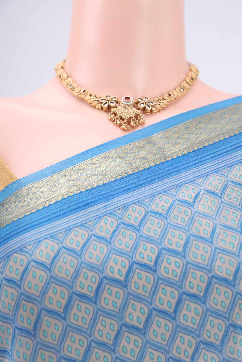 Border image of Blue Mysore Crepe Saree with Floral Print on the body and Zari Border. 