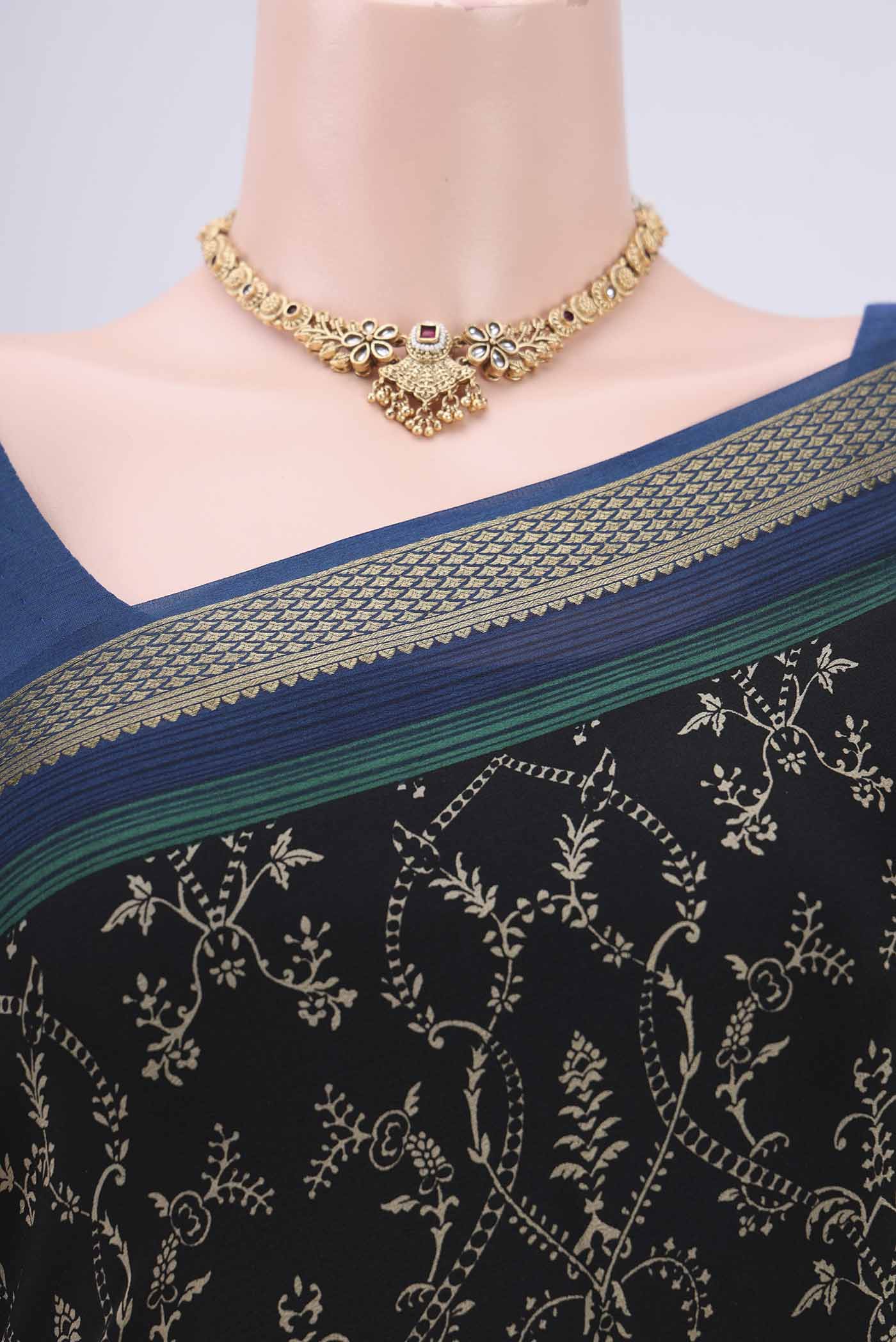 Border image of Black Mysore Crepe Saree with Floral Print on the body and Zari Border. 
