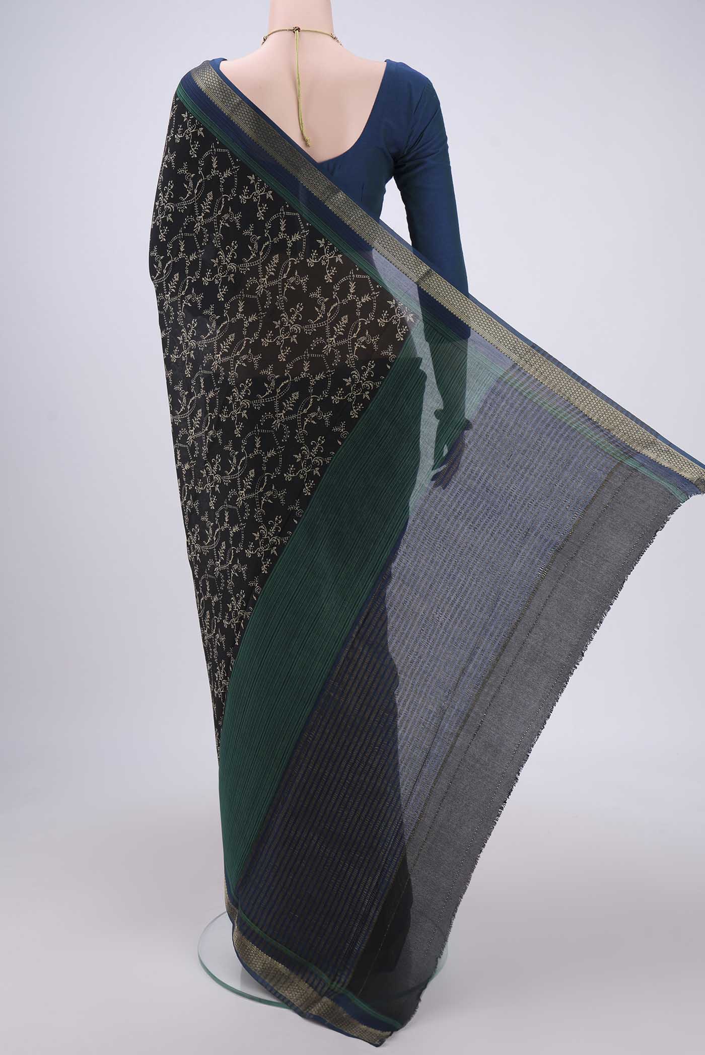 Flat view of Black Mysore Crepe Saree with Floral Print on the body and Zari Border. 