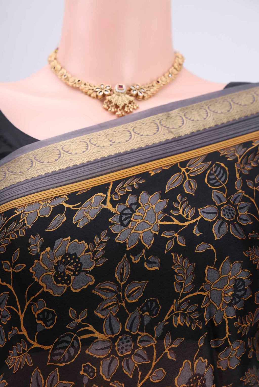 Border image of Black Mysore Crepe Saree with Floral Print on the body and Zari Border. 