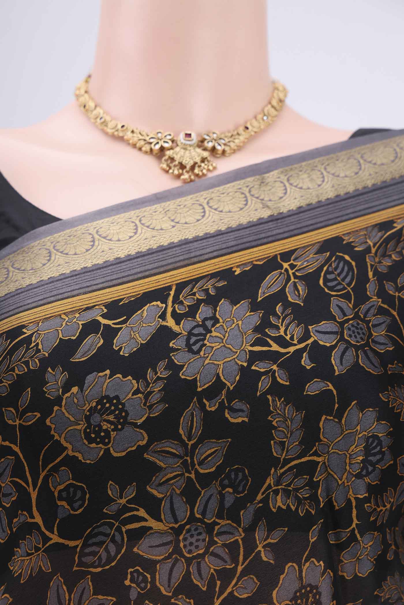Border image of Black Mysore Crepe Saree with Floral Print on the body and Zari Border. 