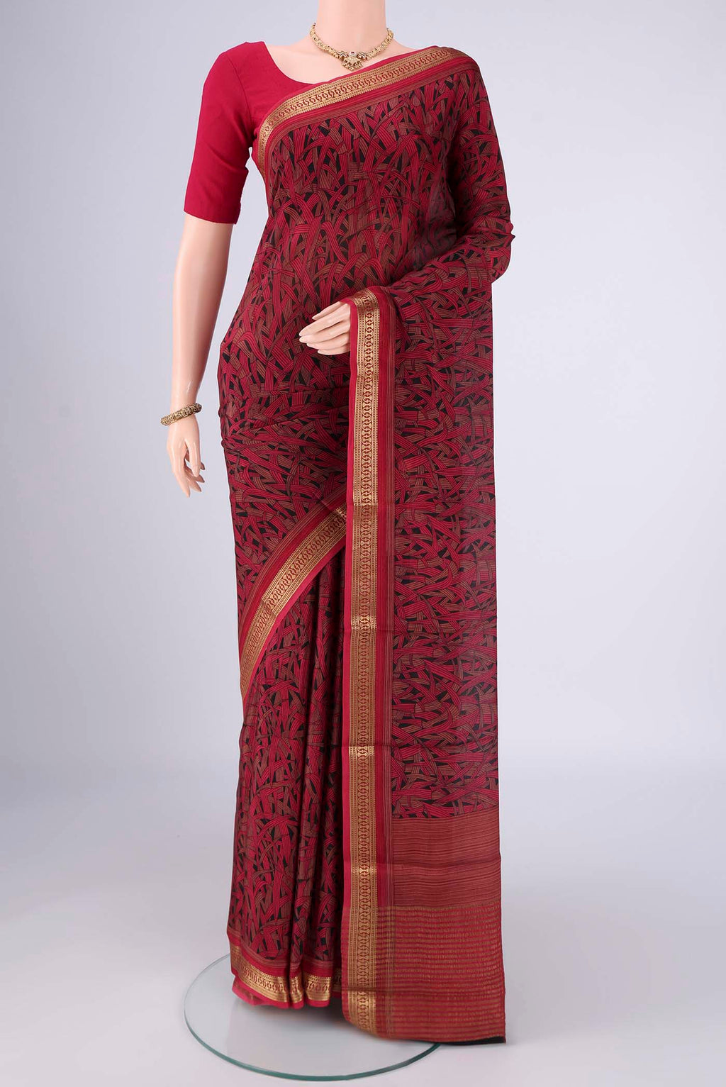 Multi Color Mysore Crepe Saree with Printed design on the body and Zari Border.  displayed on a mannequin