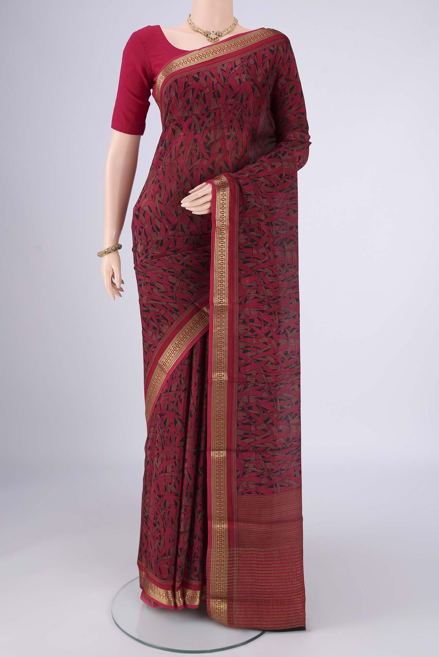 Multi Color Mysore Crepe Saree with Printed design on the body and Zari Border.  displayed on a mannequin