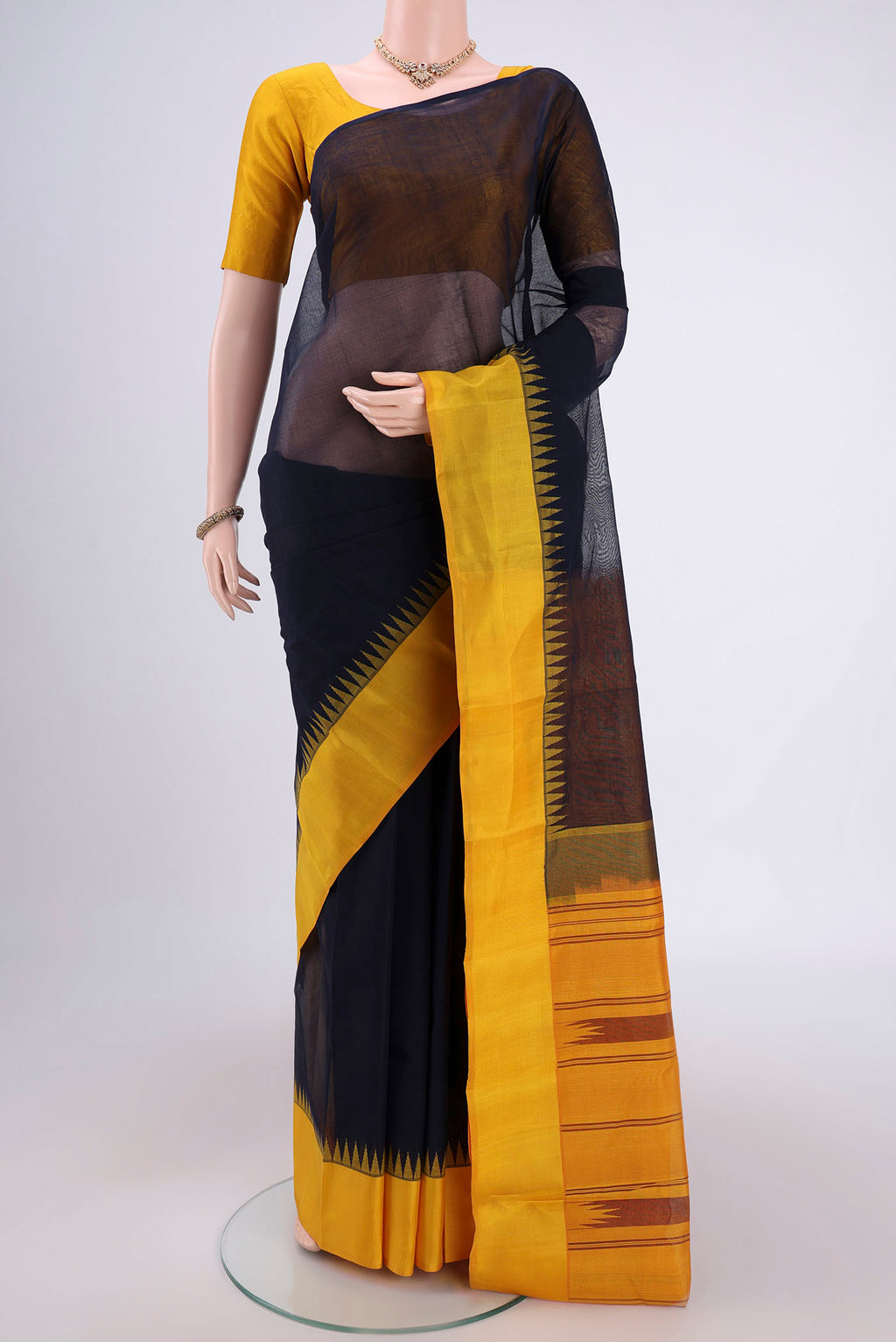Dark Blue Kanchi Cotton Saree with Checked design on the body and Zari Border.  displayed on a mannequin