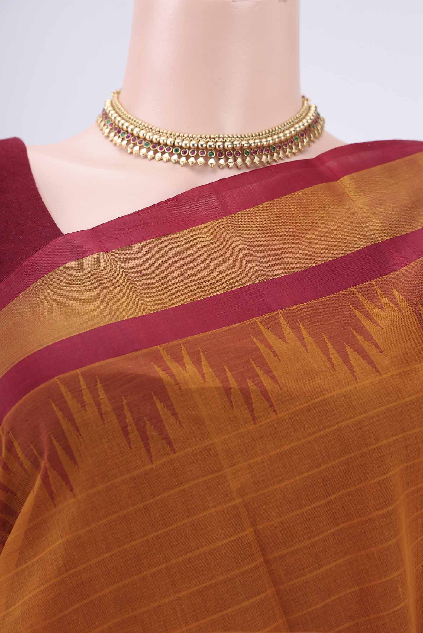 Border image of Mustard Kanchi Cotton Saree with Plain Body and Silk Border. 