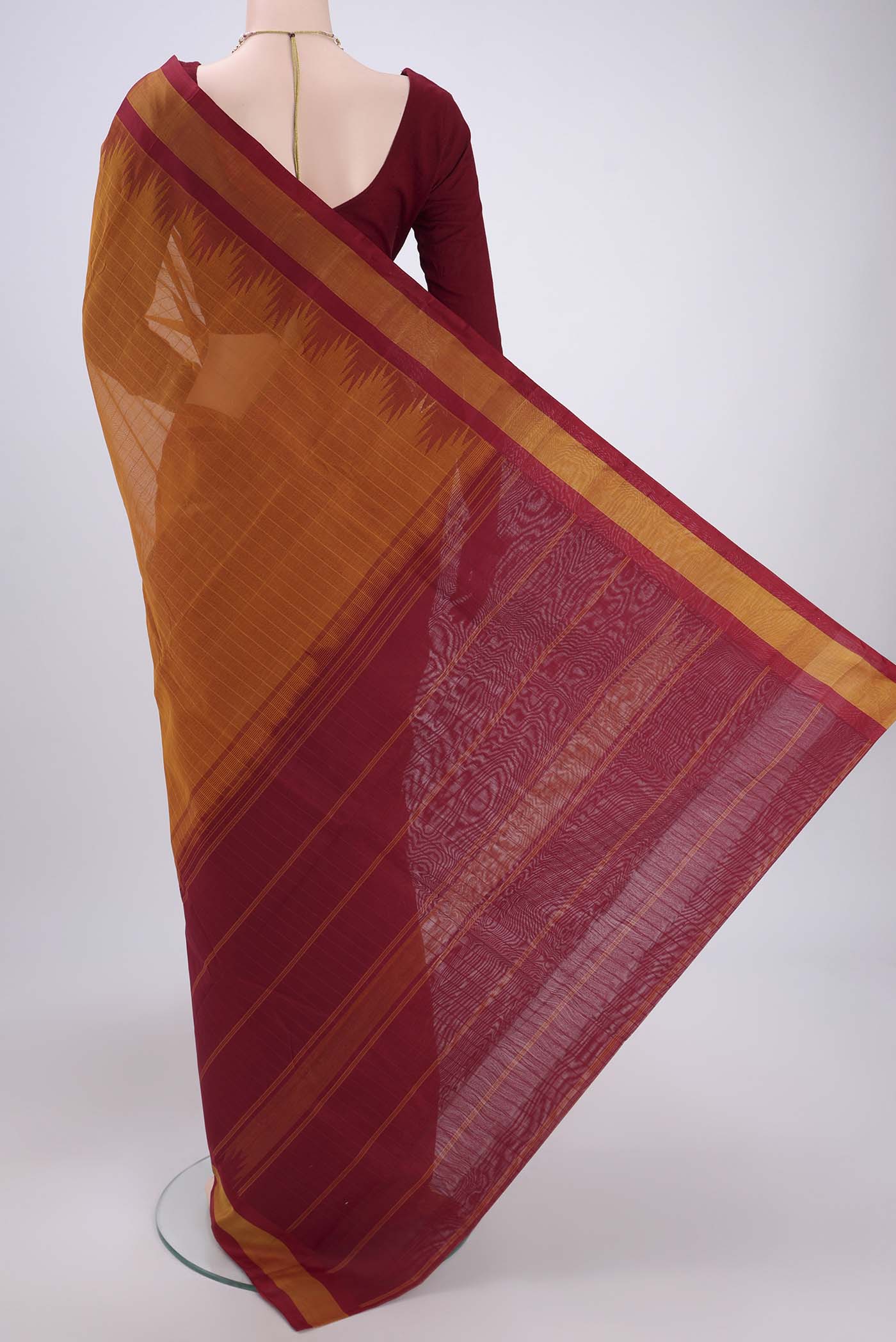 Flat view of Mustard Kanchi Cotton Saree with Plain Body and Silk Border. 