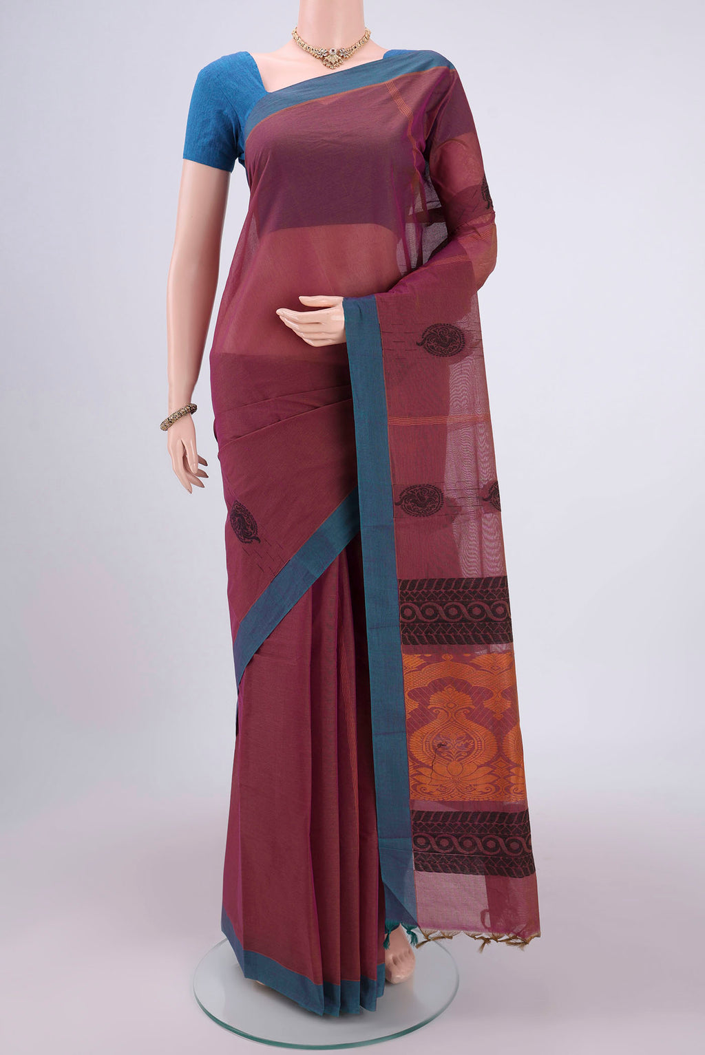 Light Magenta Kanchi Cotton Saree with Thread Butta on the body and Plain Border.  displayed on a mannequin