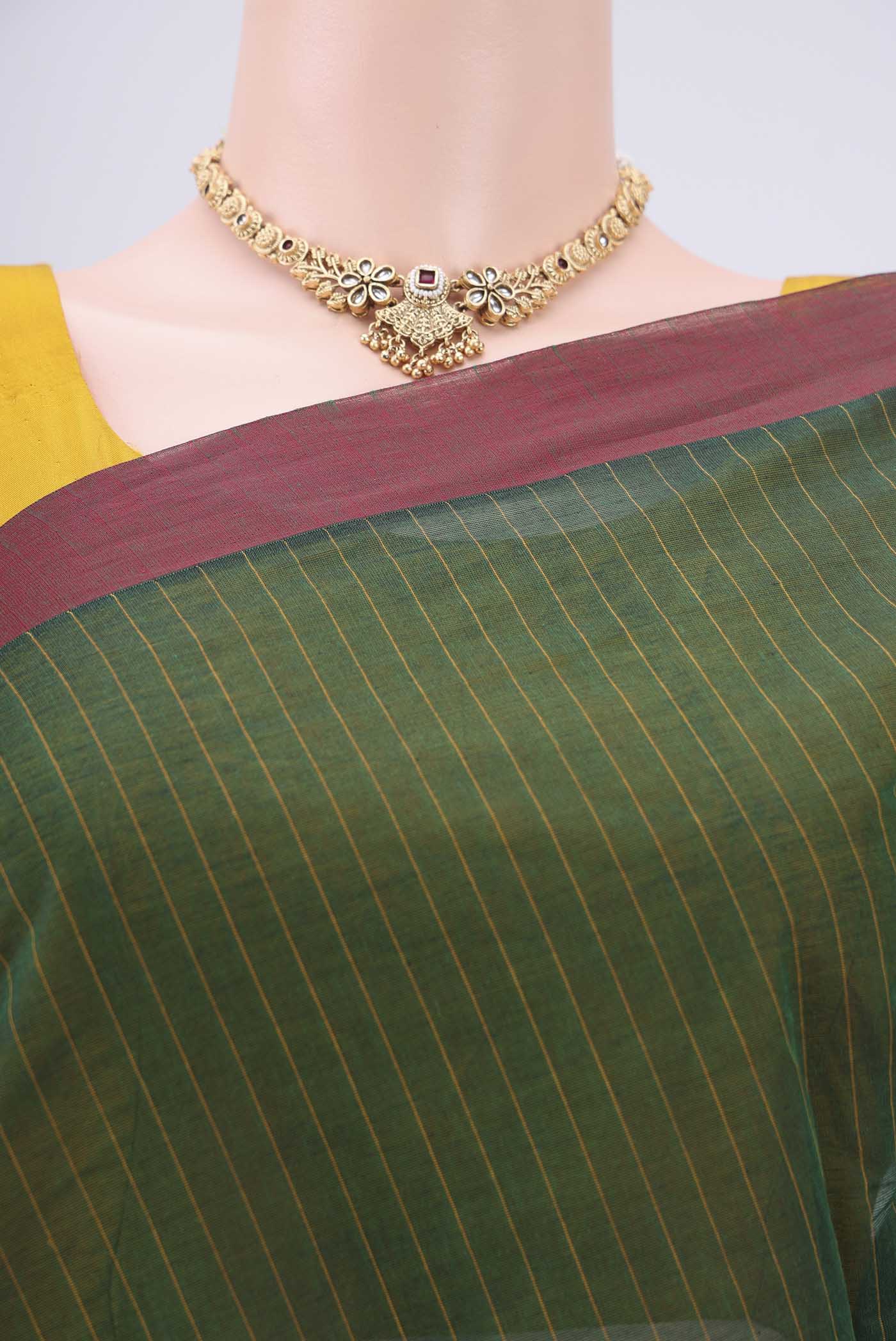 Border image of Bottle Green Kanchi Cotton Saree with Thread Butta on the body and Plain Border. 