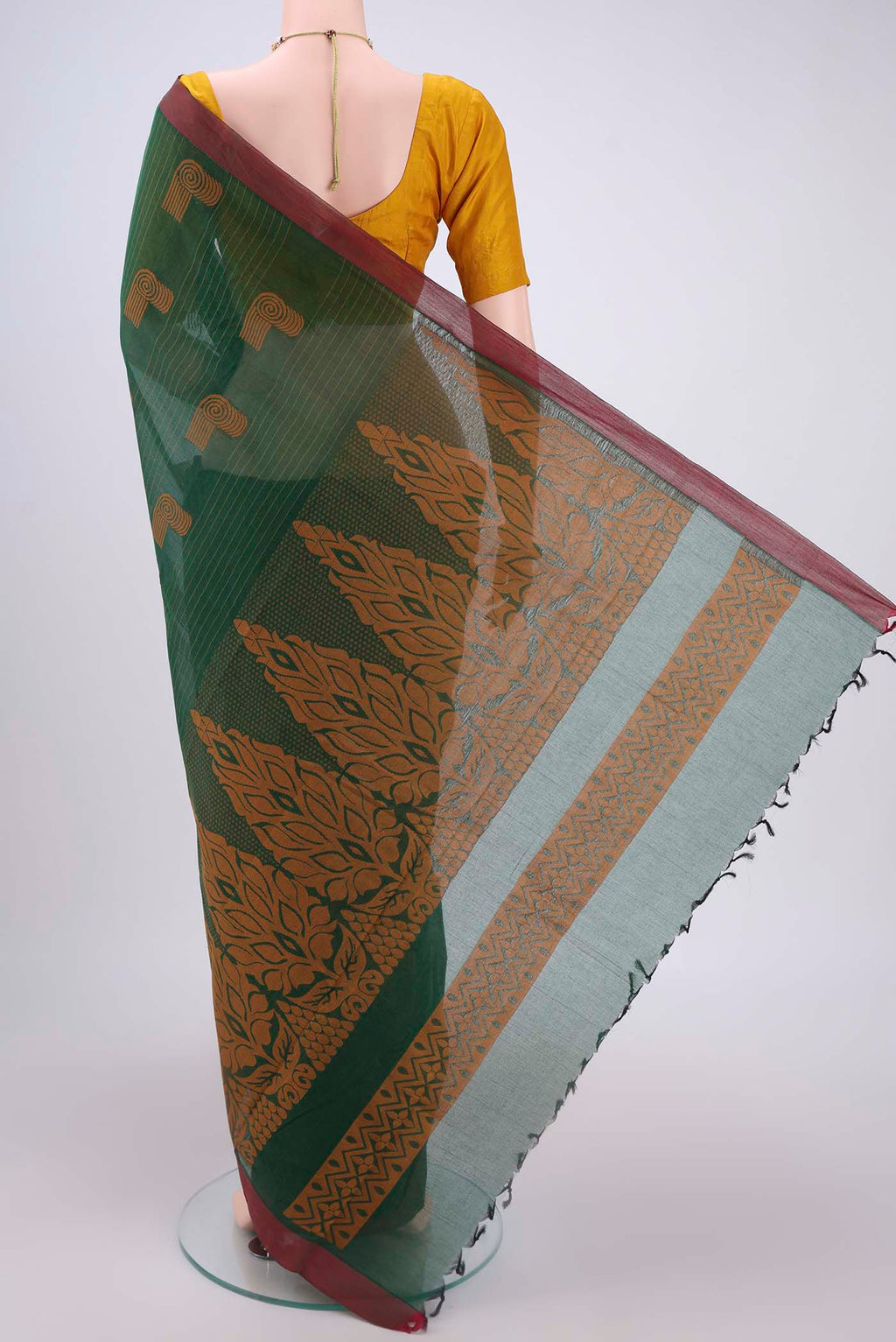 Flat view of Bottle Green Kanchi Cotton Saree with Thread Butta on the body and Plain Border. 