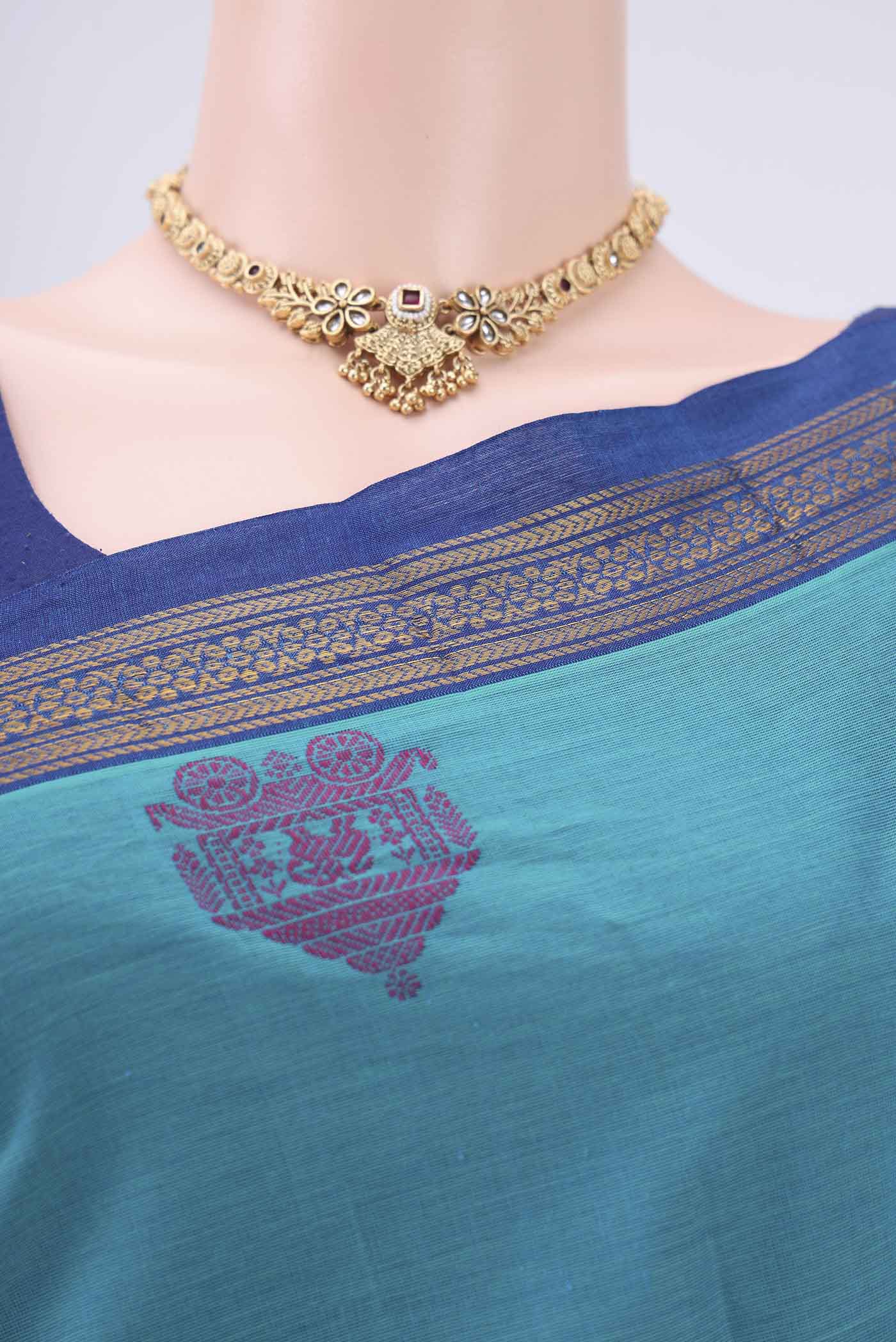 Border image of Turquoise Kanchi Cotton Saree with Thread Butta on the body and Thread Border. 