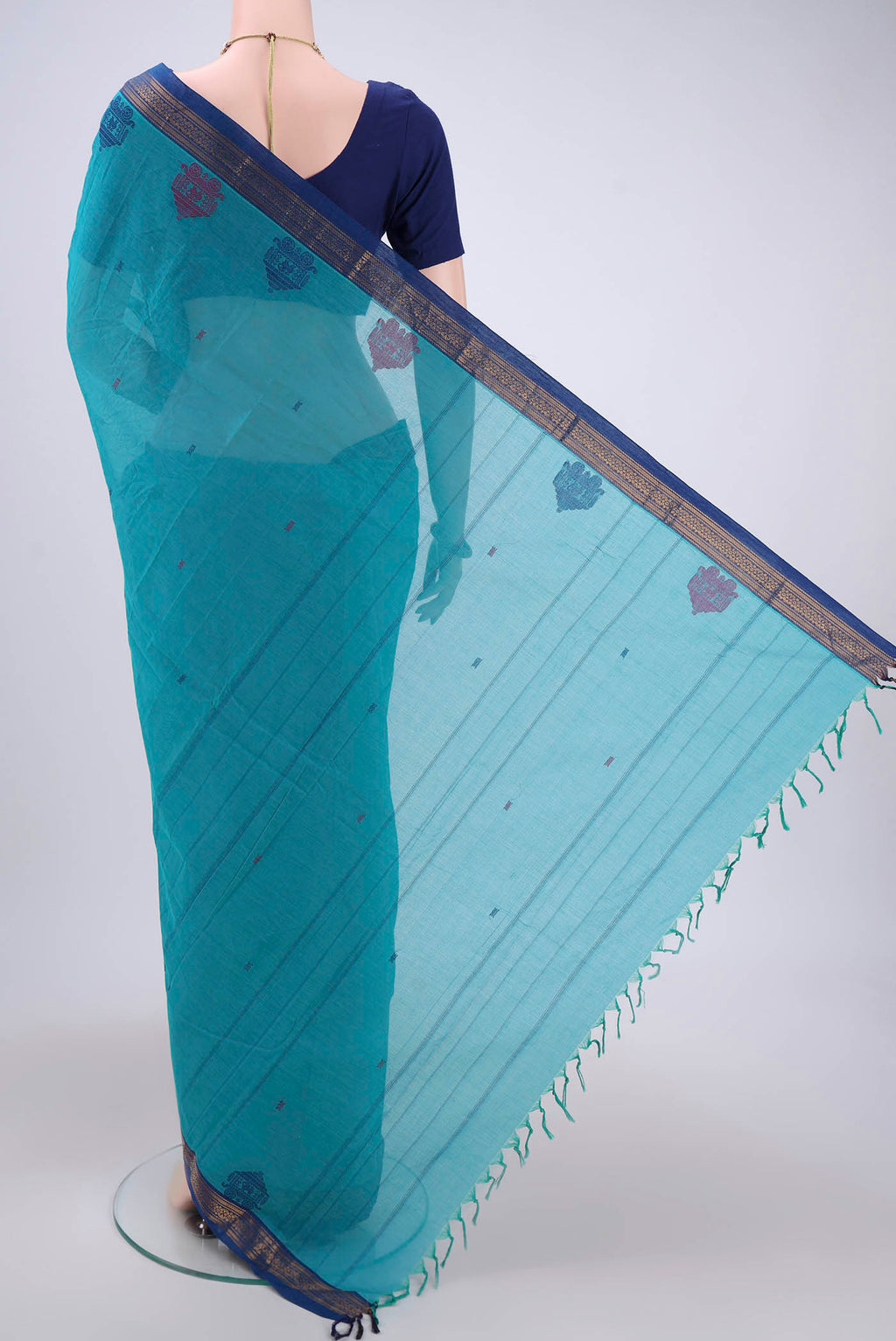 Flat view of Turquoise Kanchi Cotton Saree with Thread Butta on the body and Thread Border. 