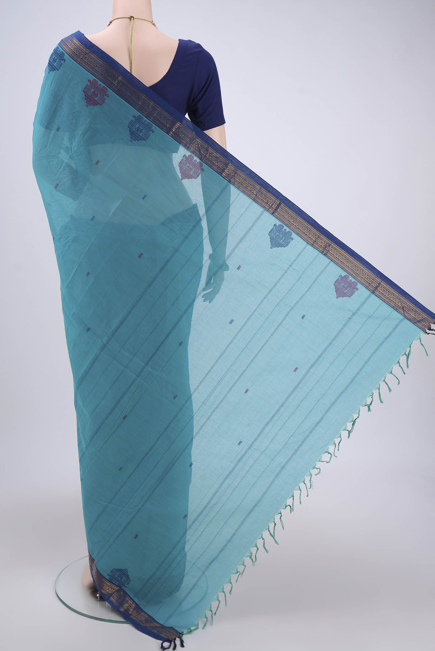 Flat view of Turquoise Kanchi Cotton Saree with Thread Butta on the body and Thread Border. 