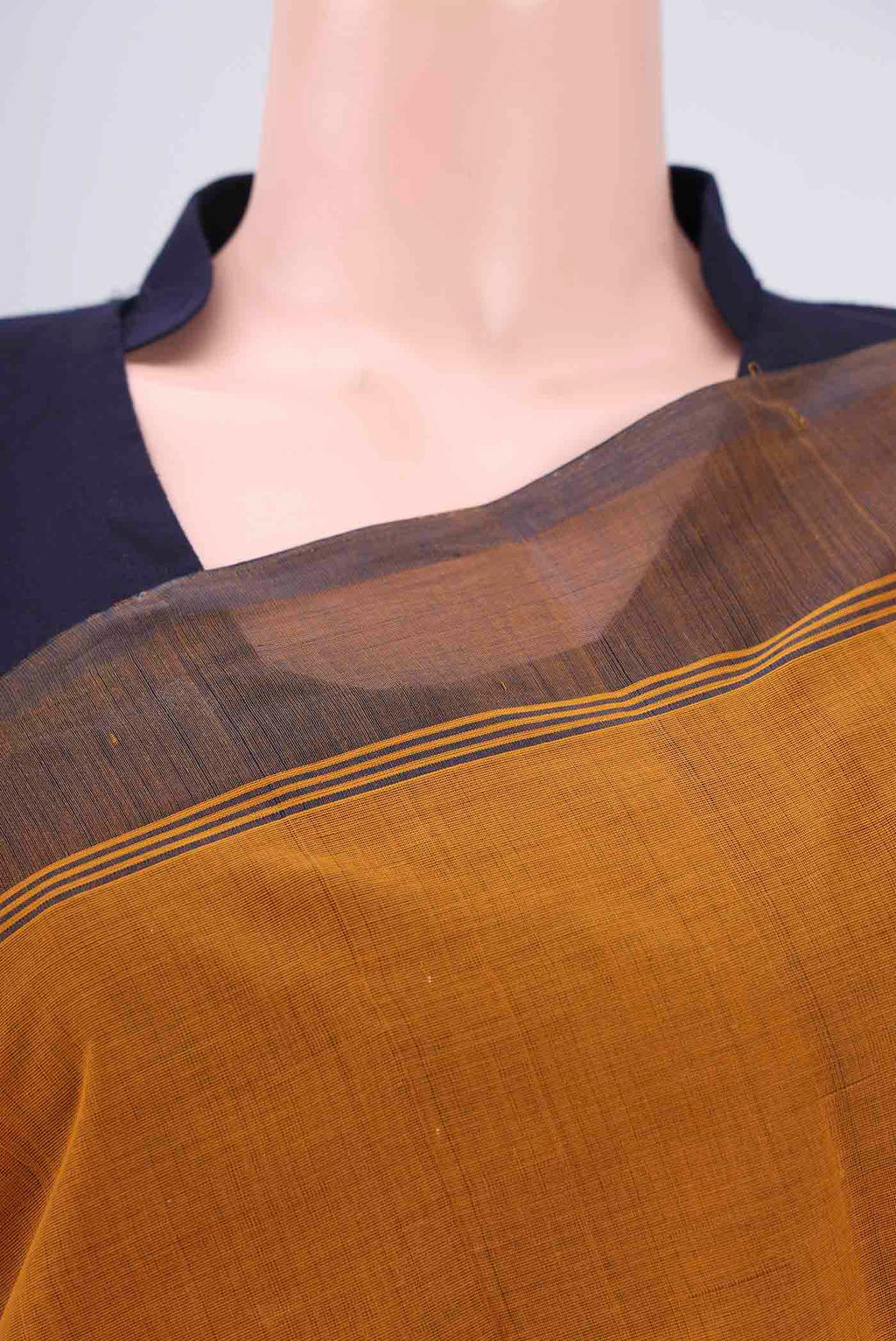 Border image of Mustard Kanchi Cotton Saree with Thread Butta on the body and Thread Border. 