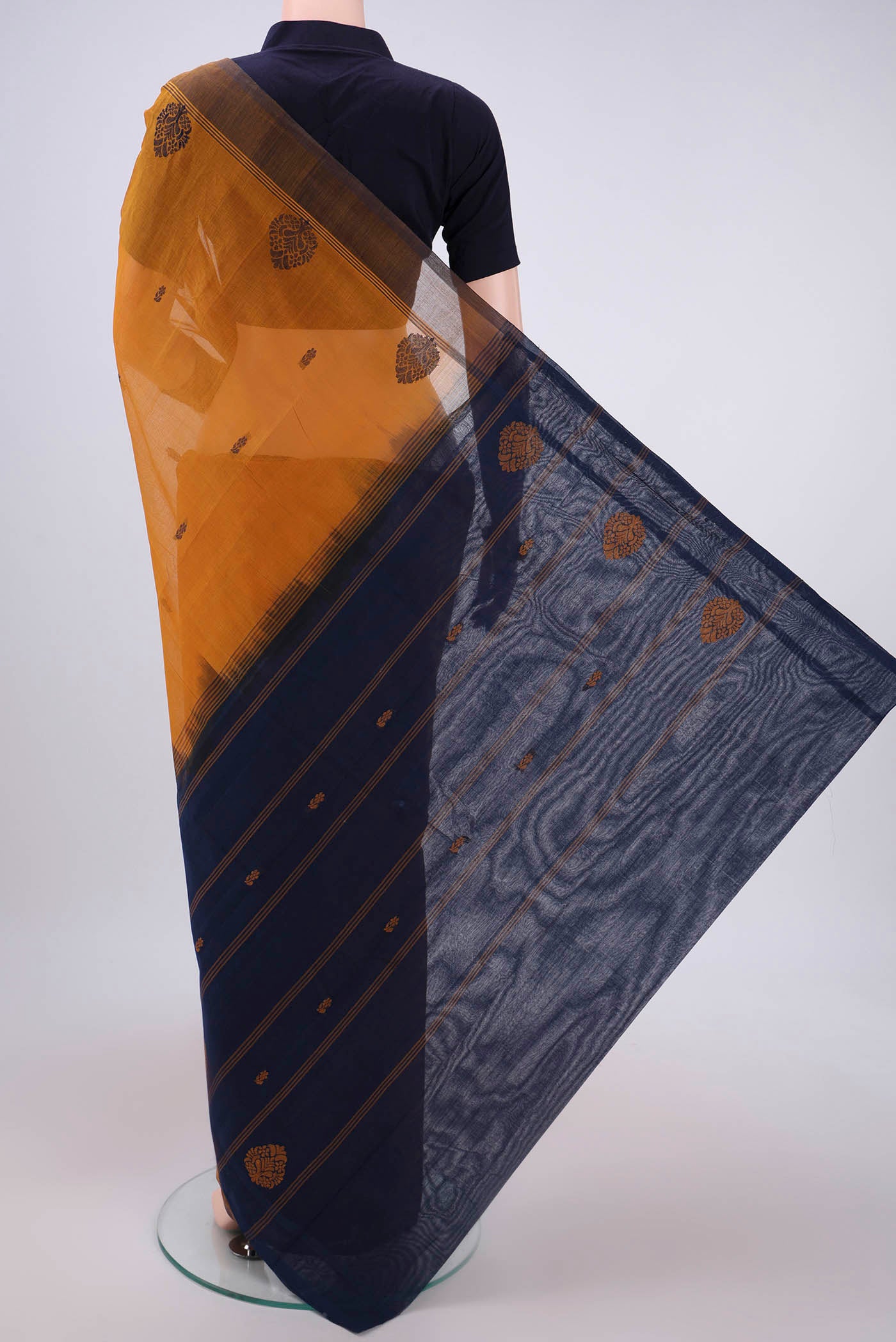 Flat view of Mustard Kanchi Cotton Saree with Thread Butta on the body and Thread Border. 
