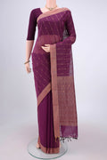 Magenta Kanchi Cotton Saree with Thread Butta on the body and Plain Border.  displayed on a mannequin