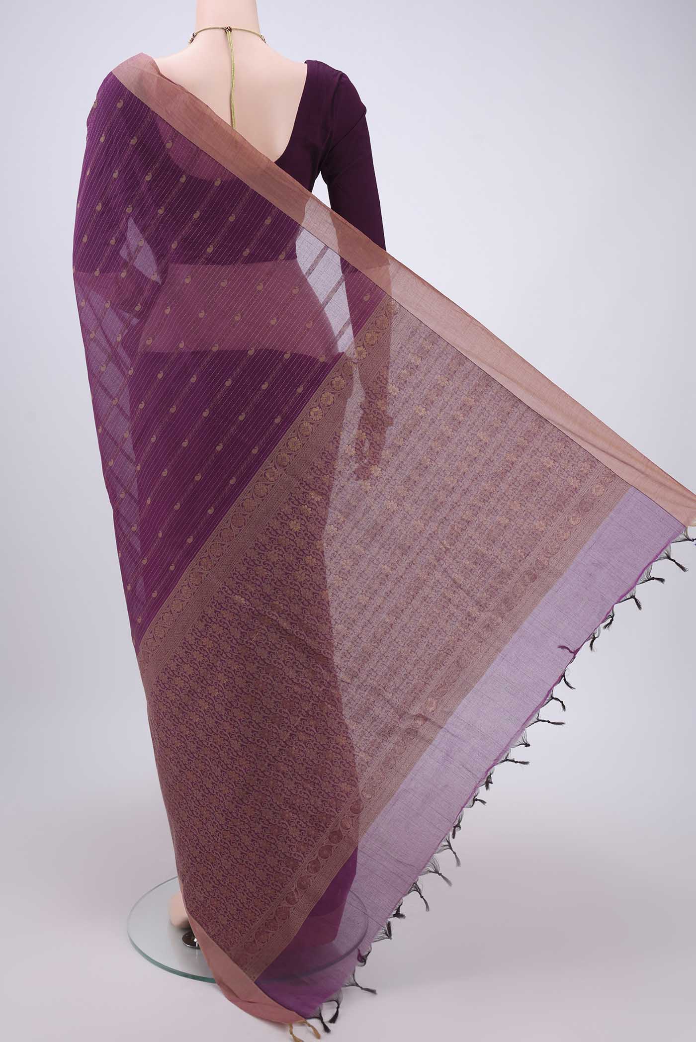 Flat view of Magenta Kanchi Cotton Saree with Thread Butta on the body and Plain Border. 