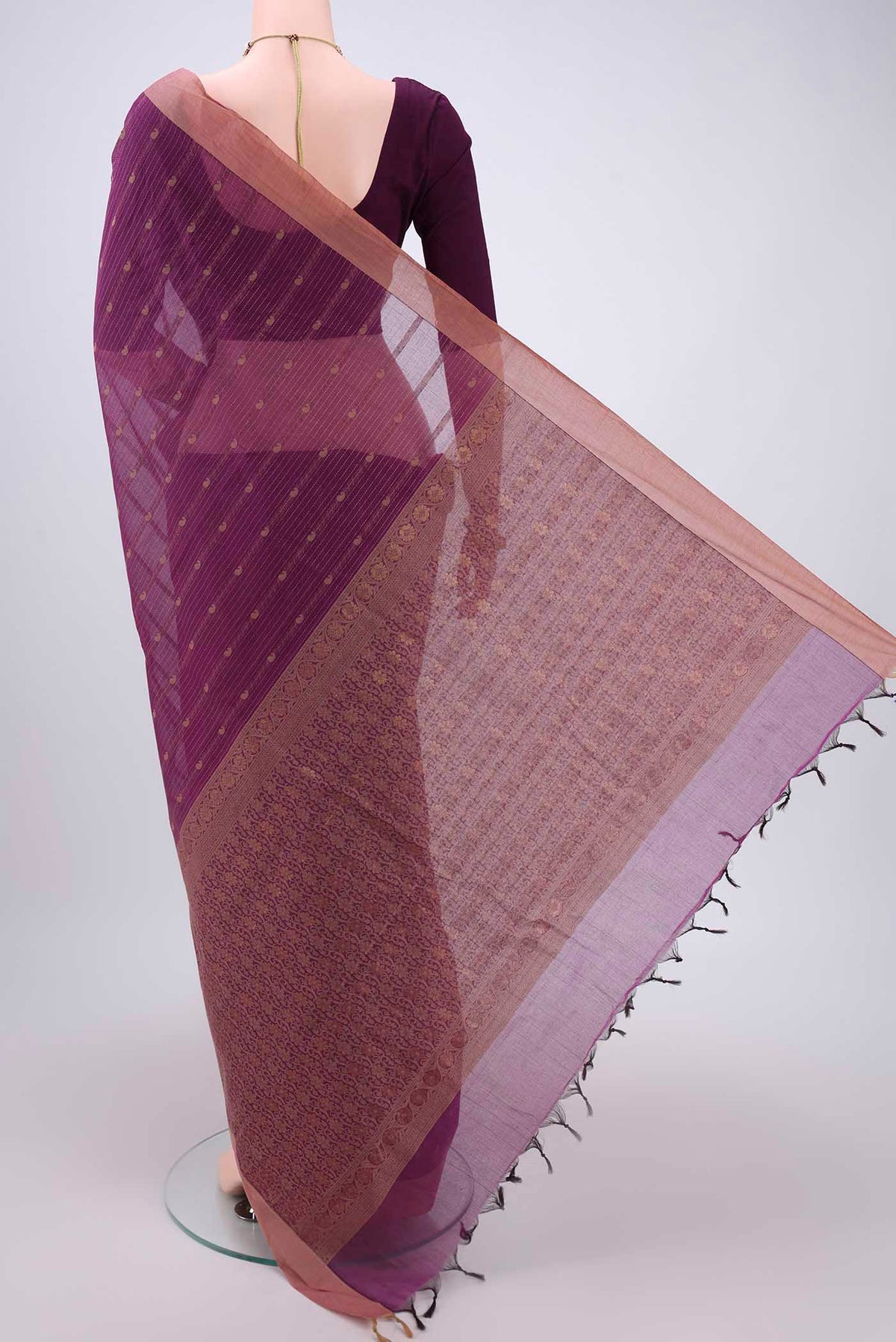 Flat view of Magenta Kanchi Cotton Saree with Thread Butta on the body and Plain Border. 