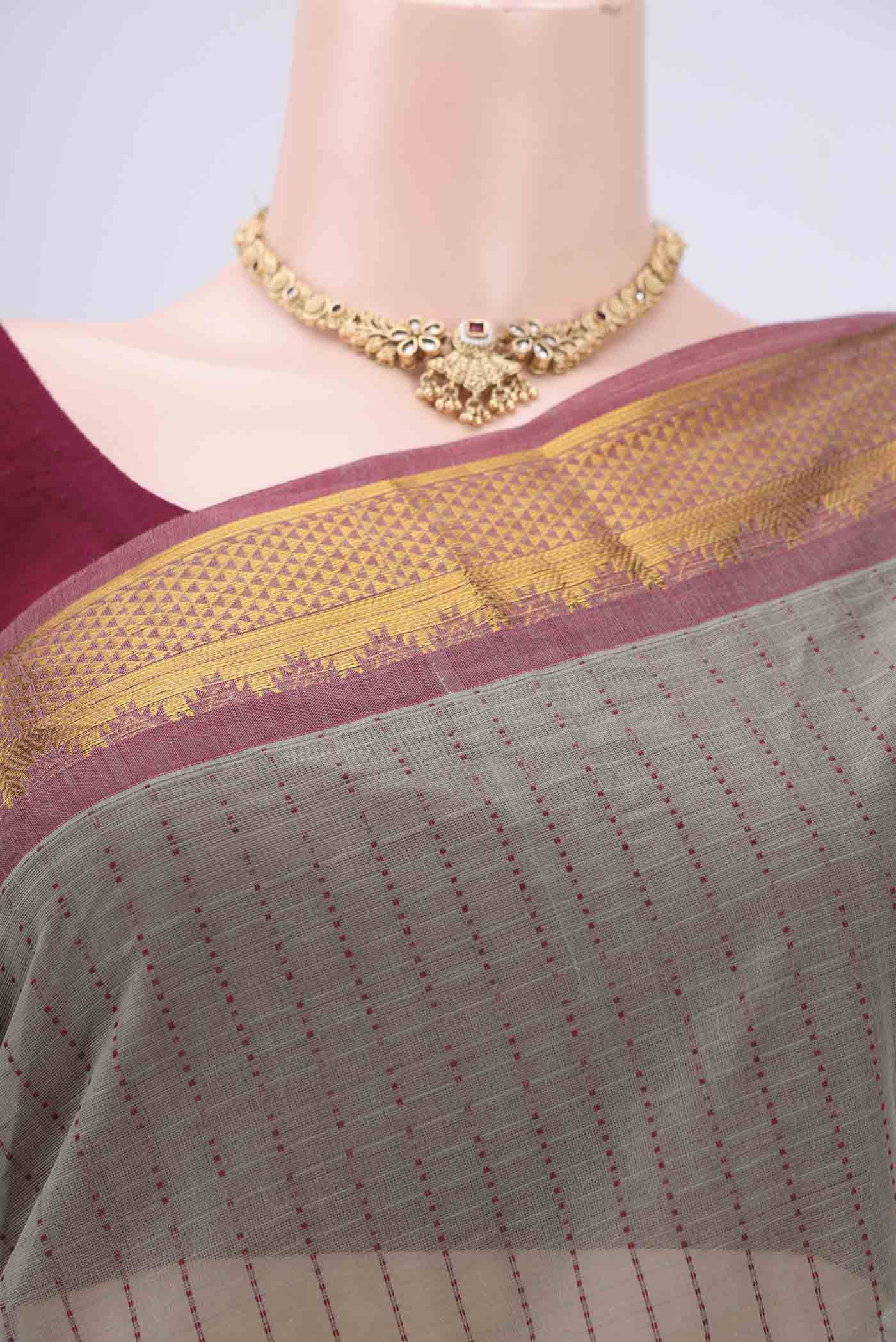 Border image of Grey Kanchi Cotton Saree with Stripes on the body and Thread Border. 