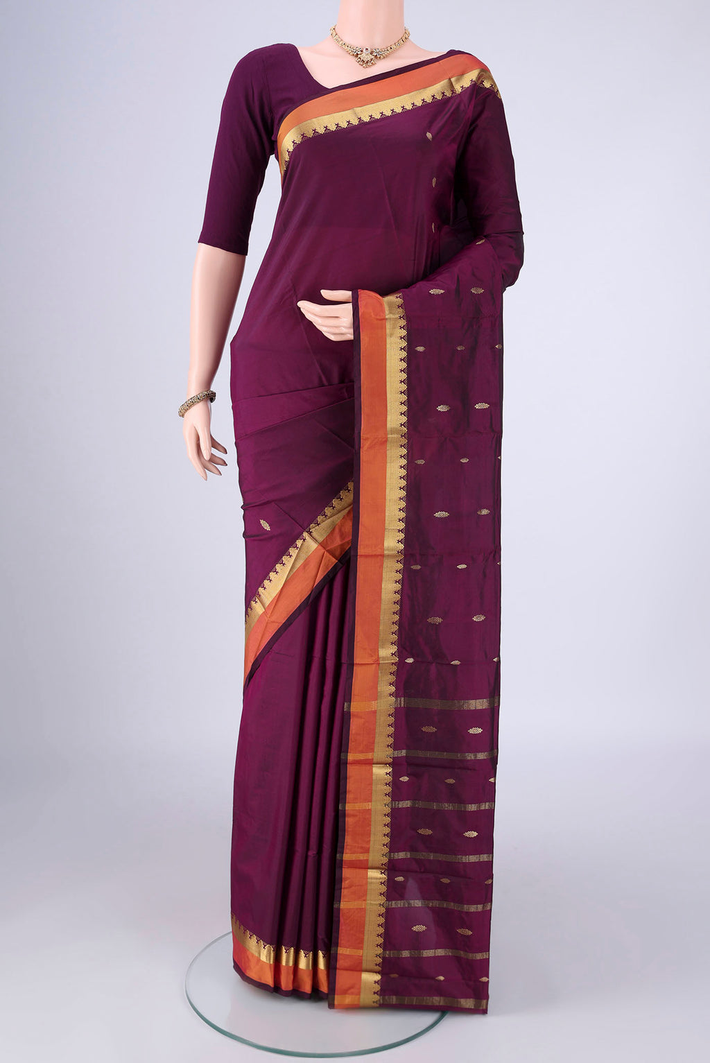 Purple Blended Bangalore Silk Saree with Zari Butta on the body and Zari Border.  displayed on a mannequin