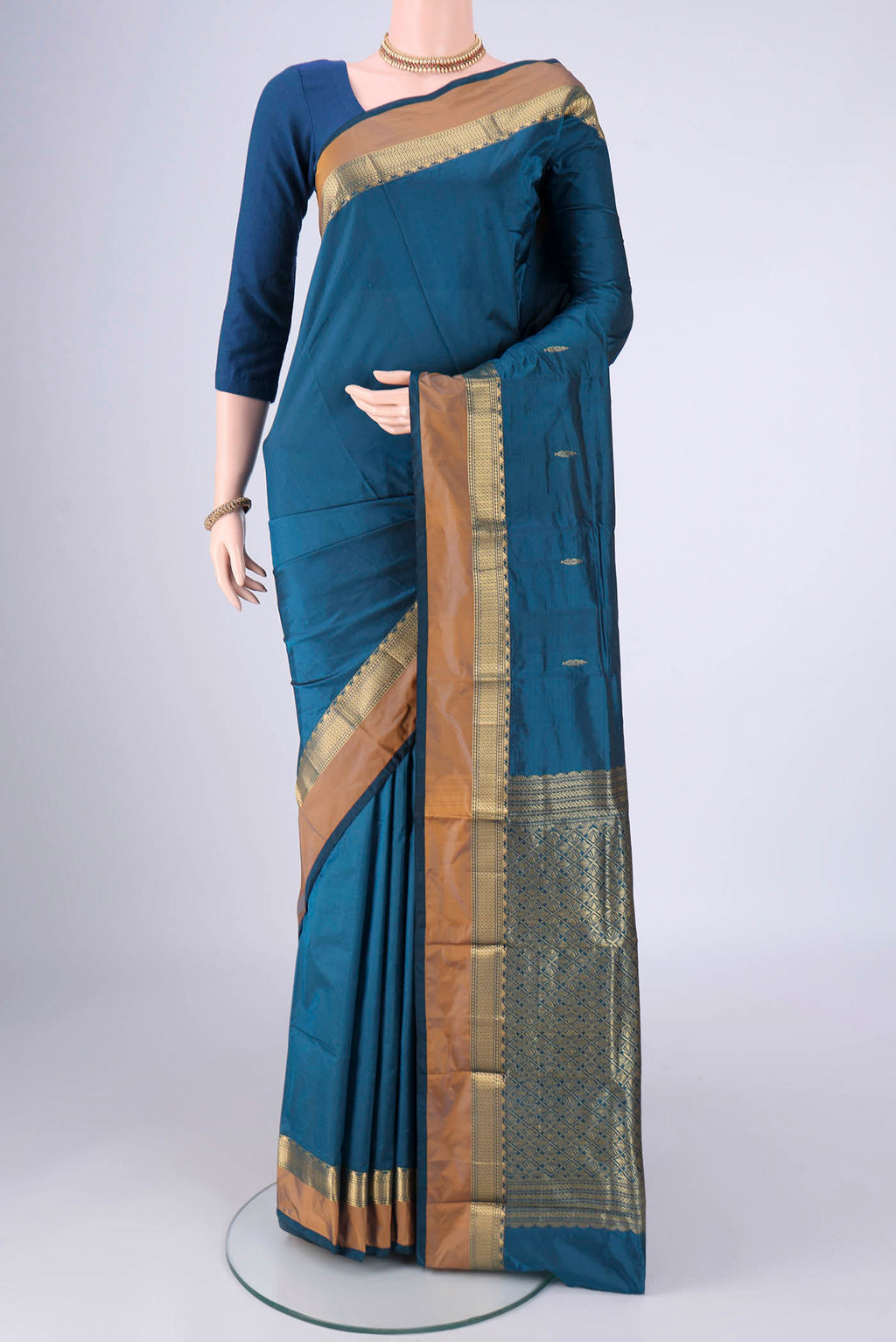 Blue Blended Bangalore Silk Saree with Zari Butta on the body and Zari Border.  displayed on a mannequin