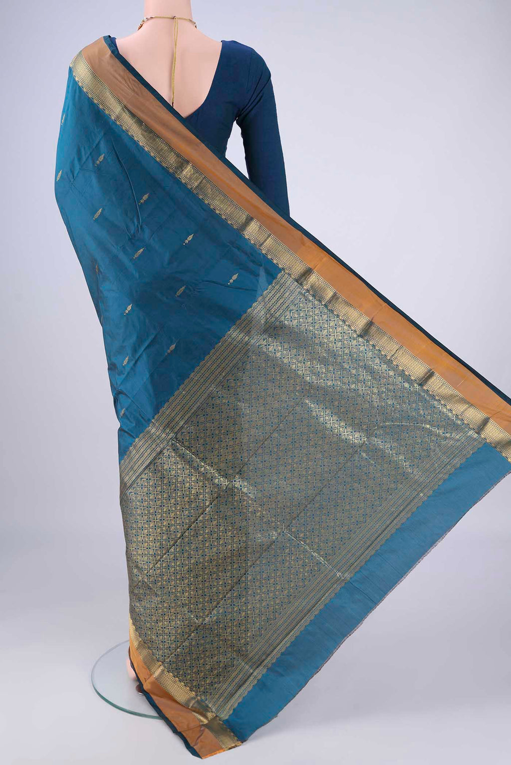 Flat view of Blue Blended Bangalore Silk Saree with Zari Butta on the body and Zari Border. 