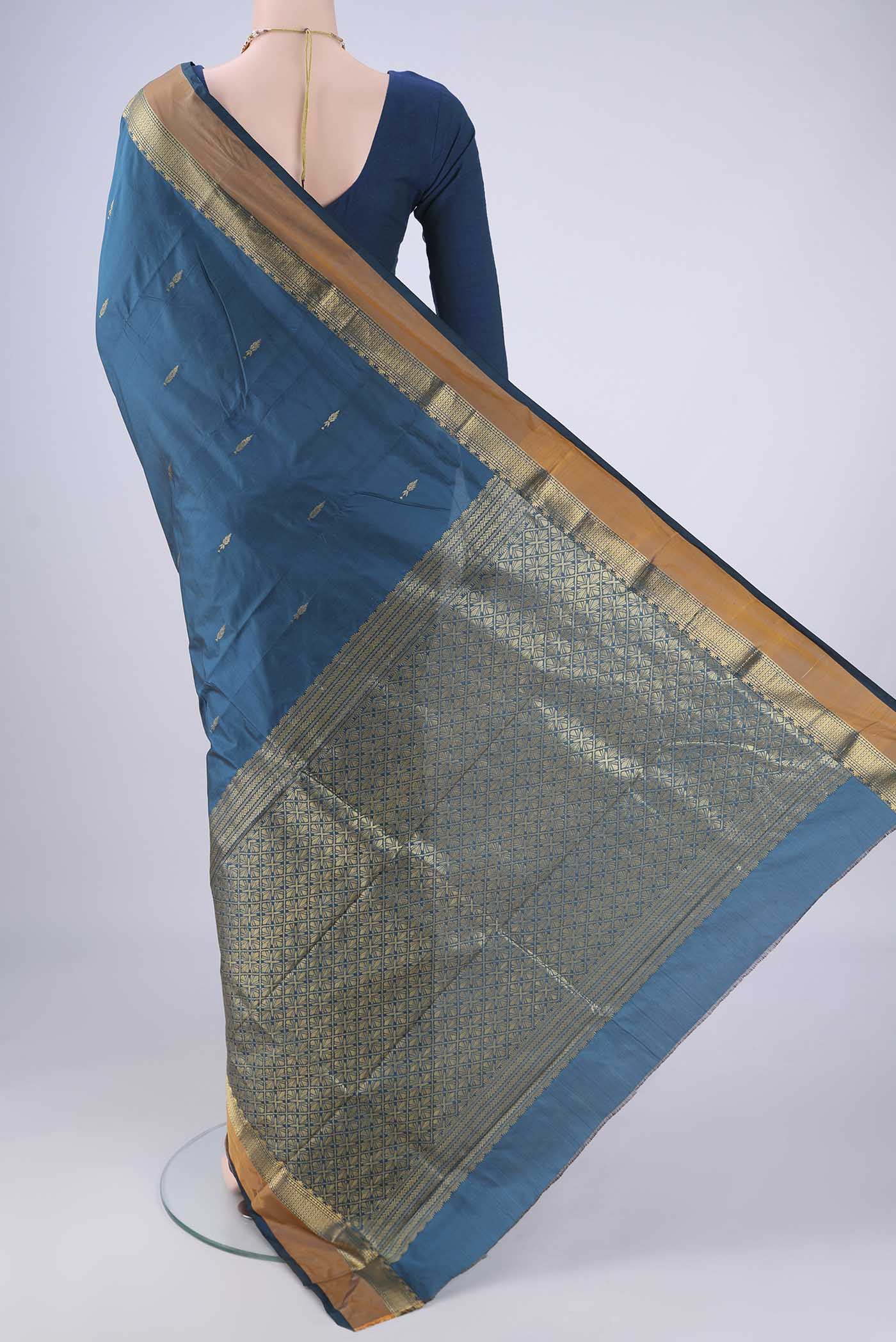 Flat view of Blue Blended Bangalore Silk Saree with Zari Butta on the body and Zari Border. 