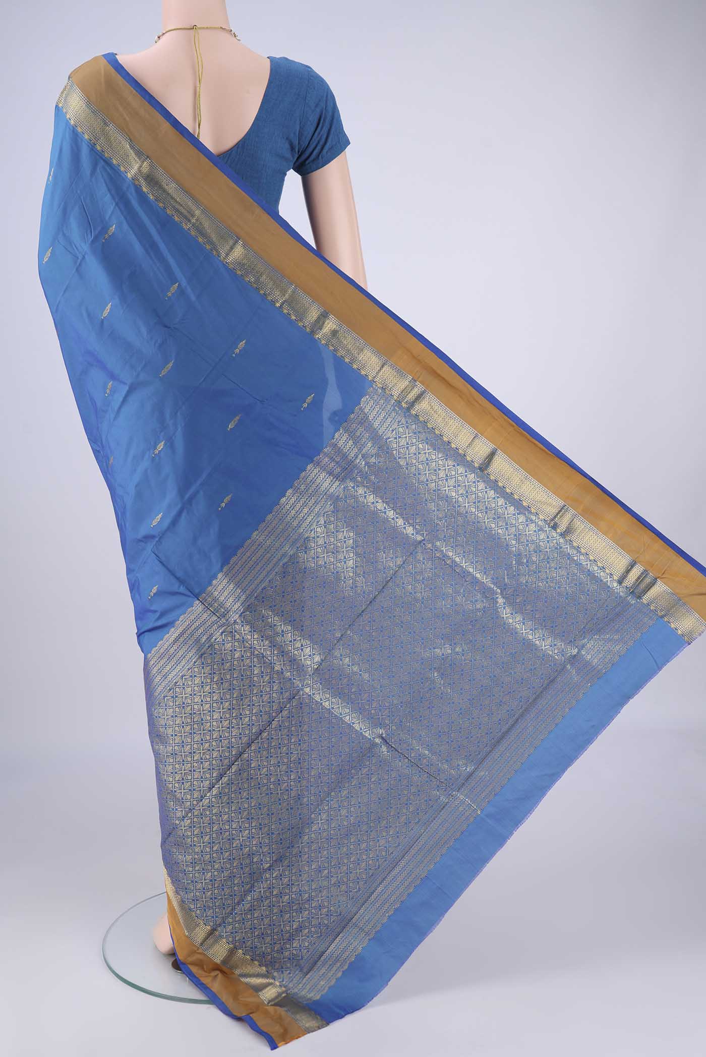 Flat view of Blue Blended Bangalore Silk Saree with Zari Butta on the body and Zari Border. 