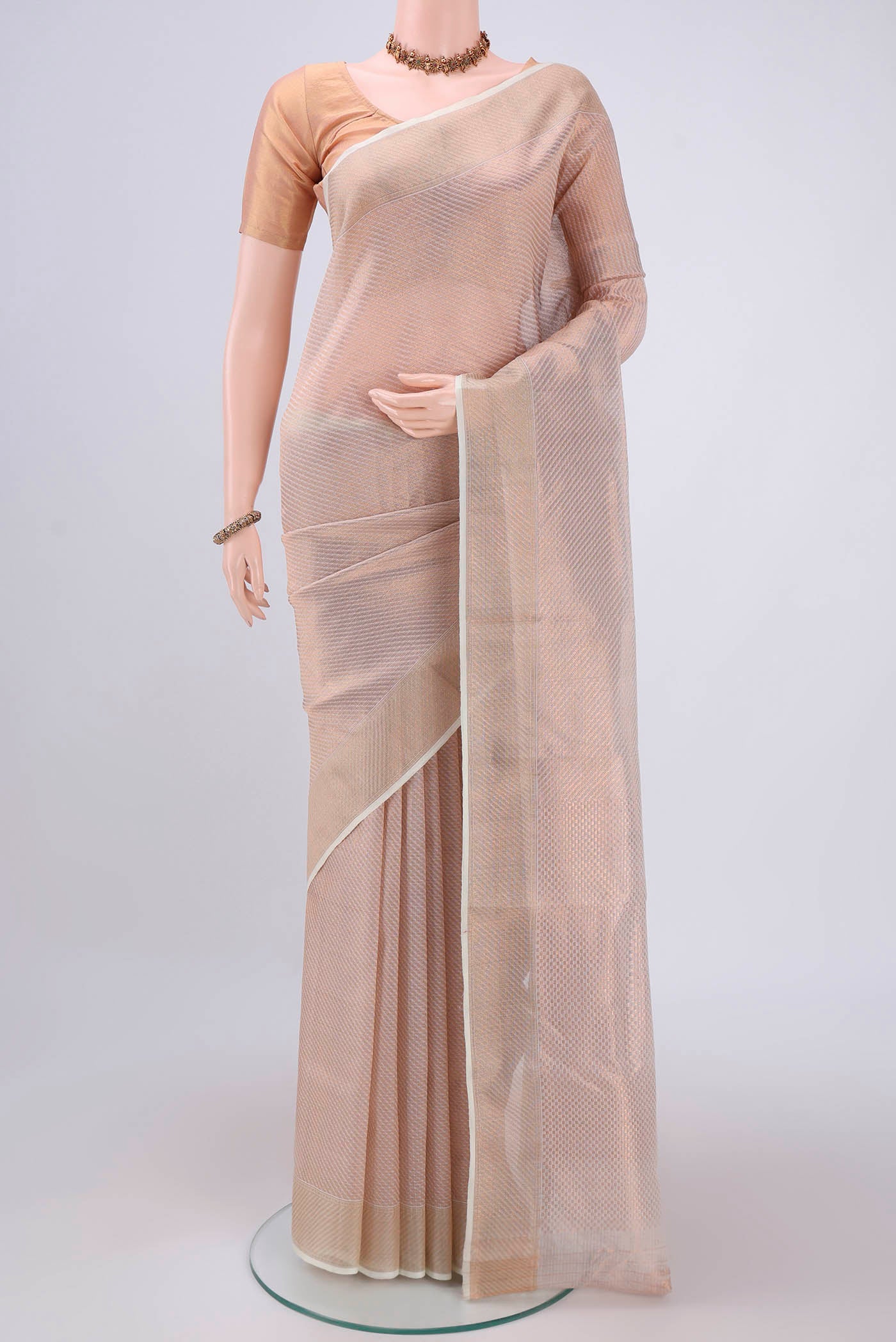 Pure Silk Pure Zari Off White Kota Saree with Zari Brocade on the body and Zari Border.  displayed on a mannequin