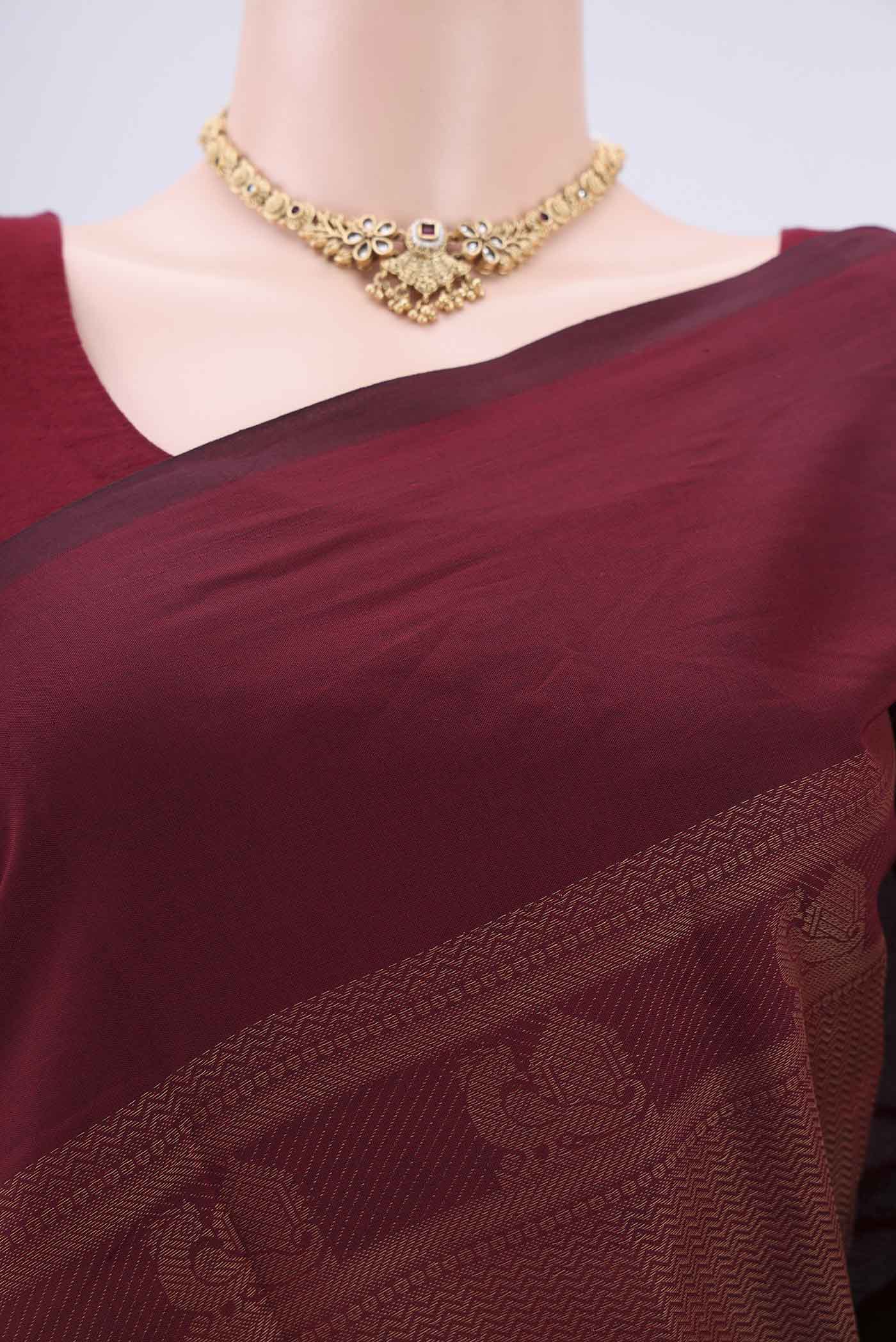 Border image of Maroon Blended Poly Cotton Saree with Jacquard design on the body and Plain Border. 