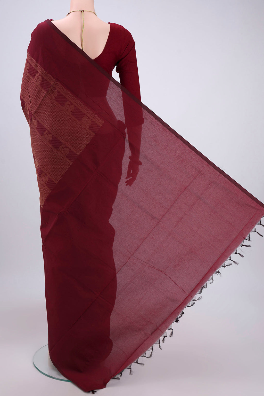 Flat view of Maroon Blended Poly Cotton Saree with Jacquard design on the body and Plain Border. 