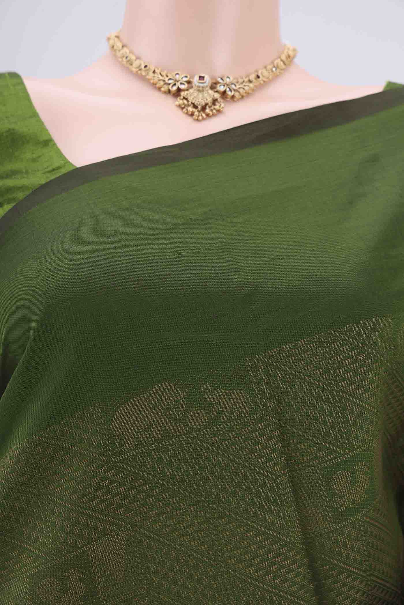 Border image of Green Blended Poly Cotton Saree with Jacquard design on the body and Plain Border. 