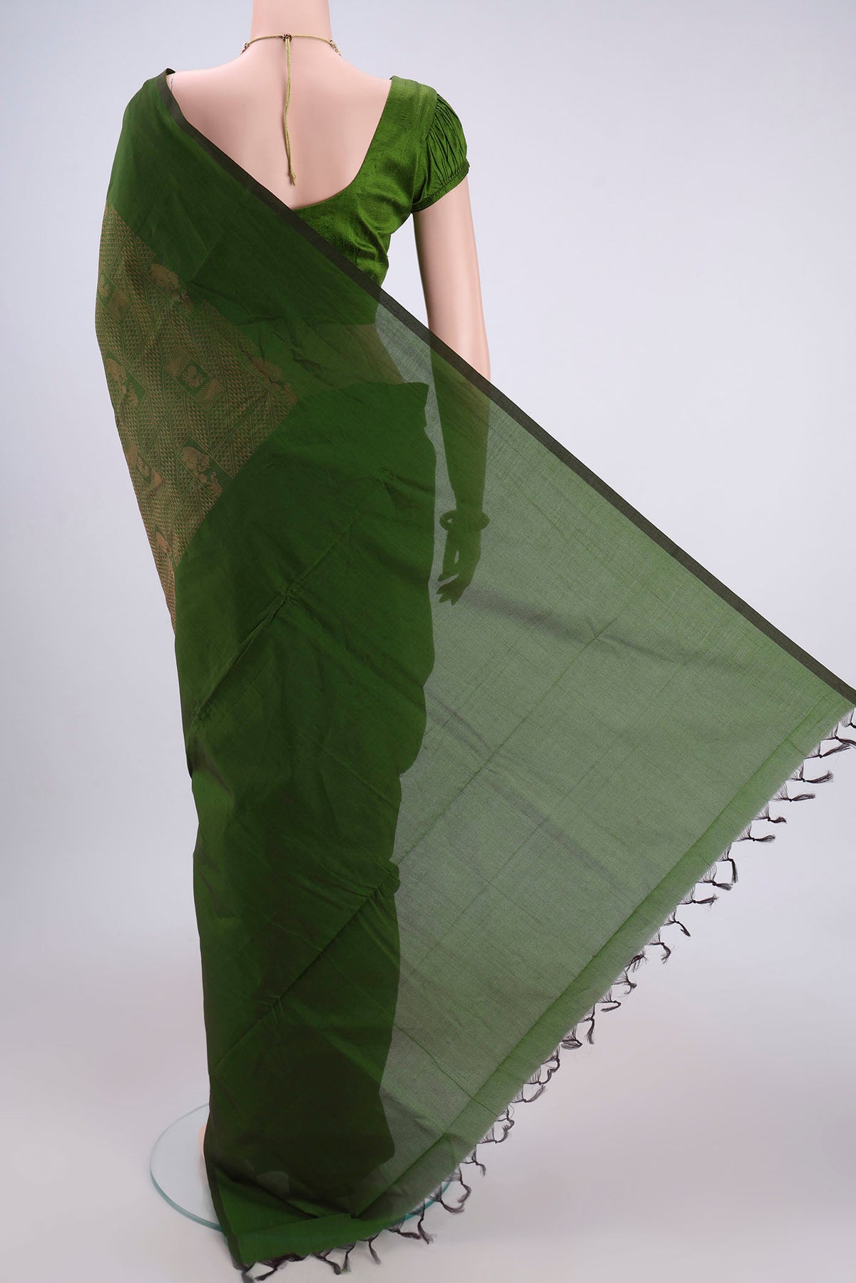 Flat view of Green Blended Poly Cotton Saree with Jacquard design on the body and Plain Border. 