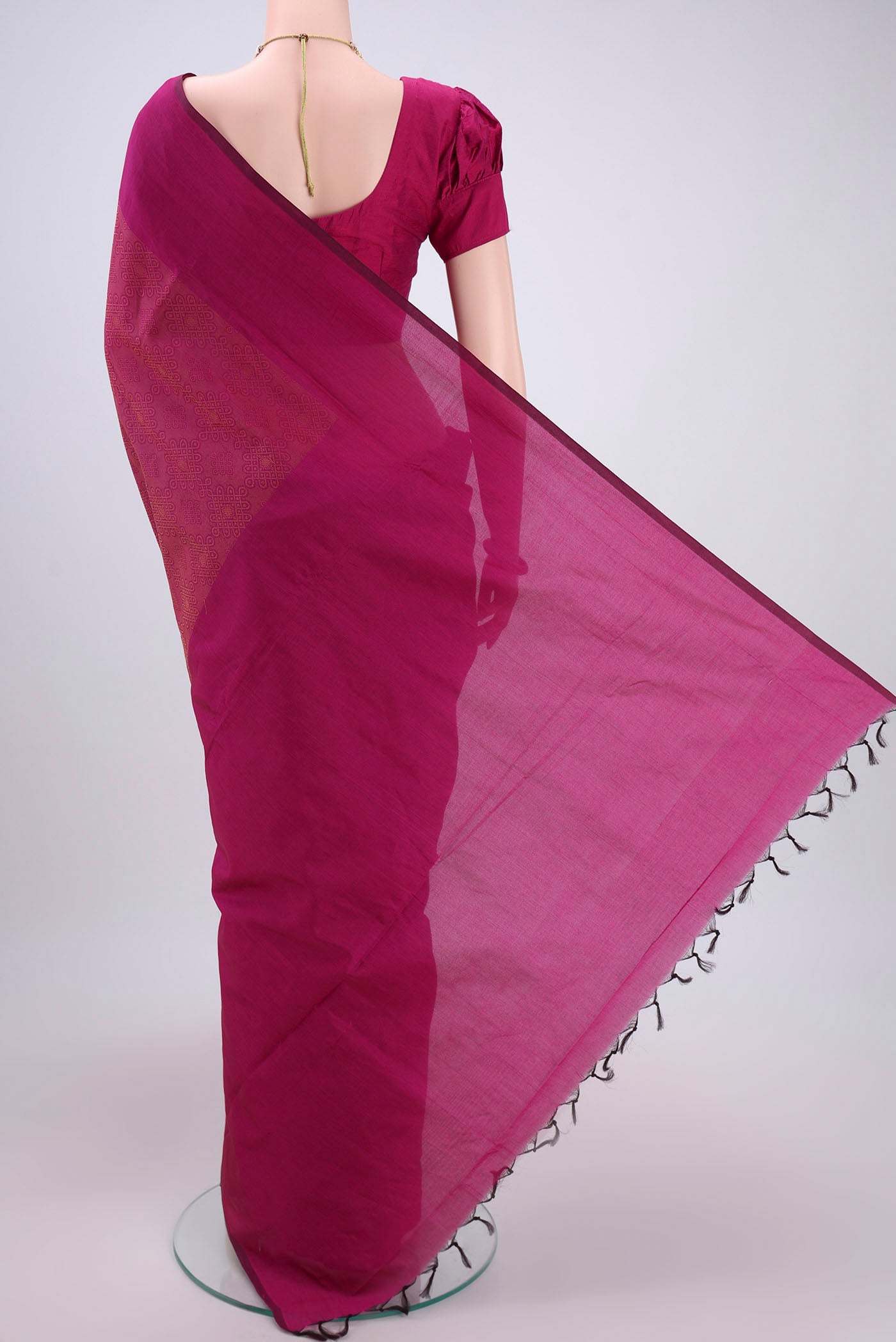 Flat view of Rani Pink Blended Poly Cotton Saree with Jacquard design on the body and Plain Border. 