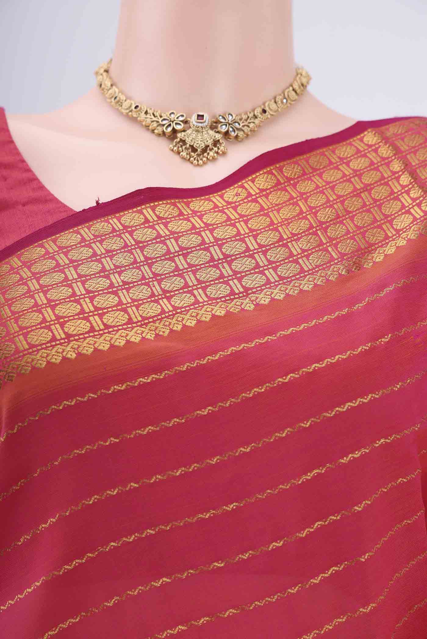 Border image of Pink Silk Cotton Saree with Stripes on the body and Plain Border. 
