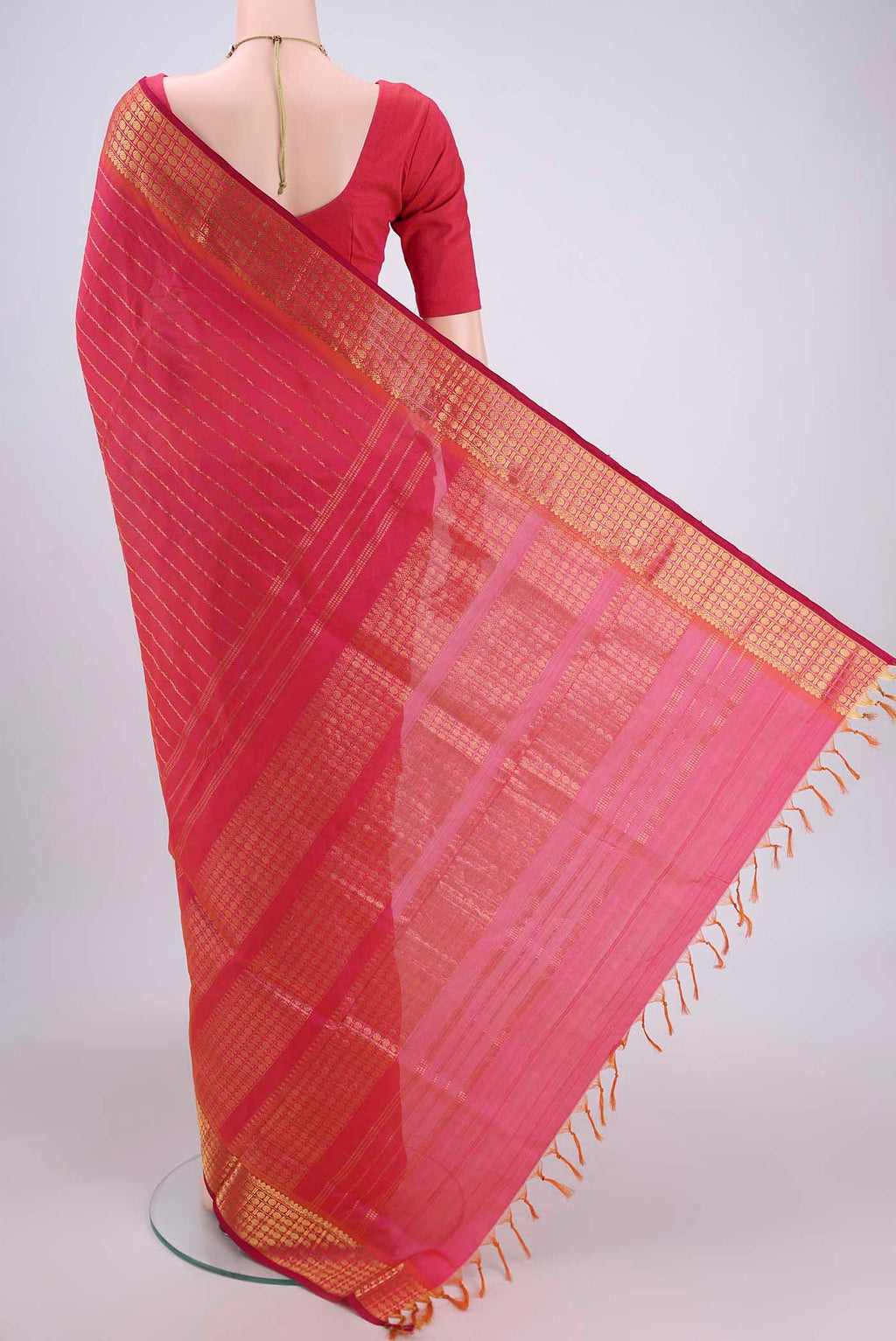 Flat view of Pink Silk Cotton Saree with Stripes on the body and Plain Border. 