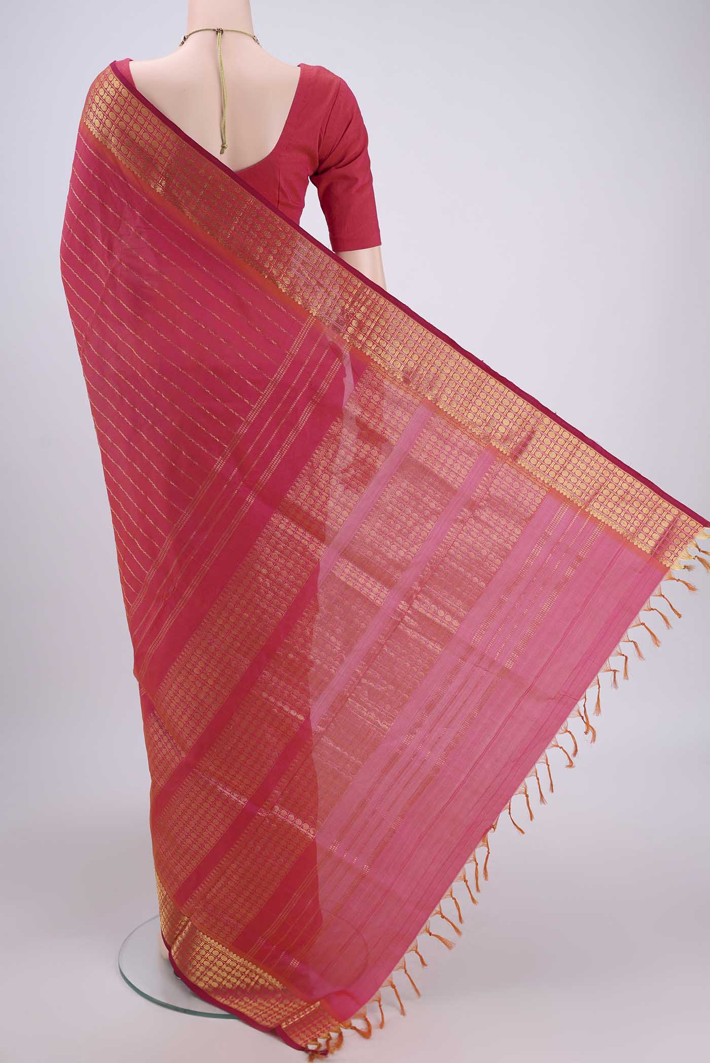 Flat view of Pink Silk Cotton Saree with Stripes on the body and Plain Border. 