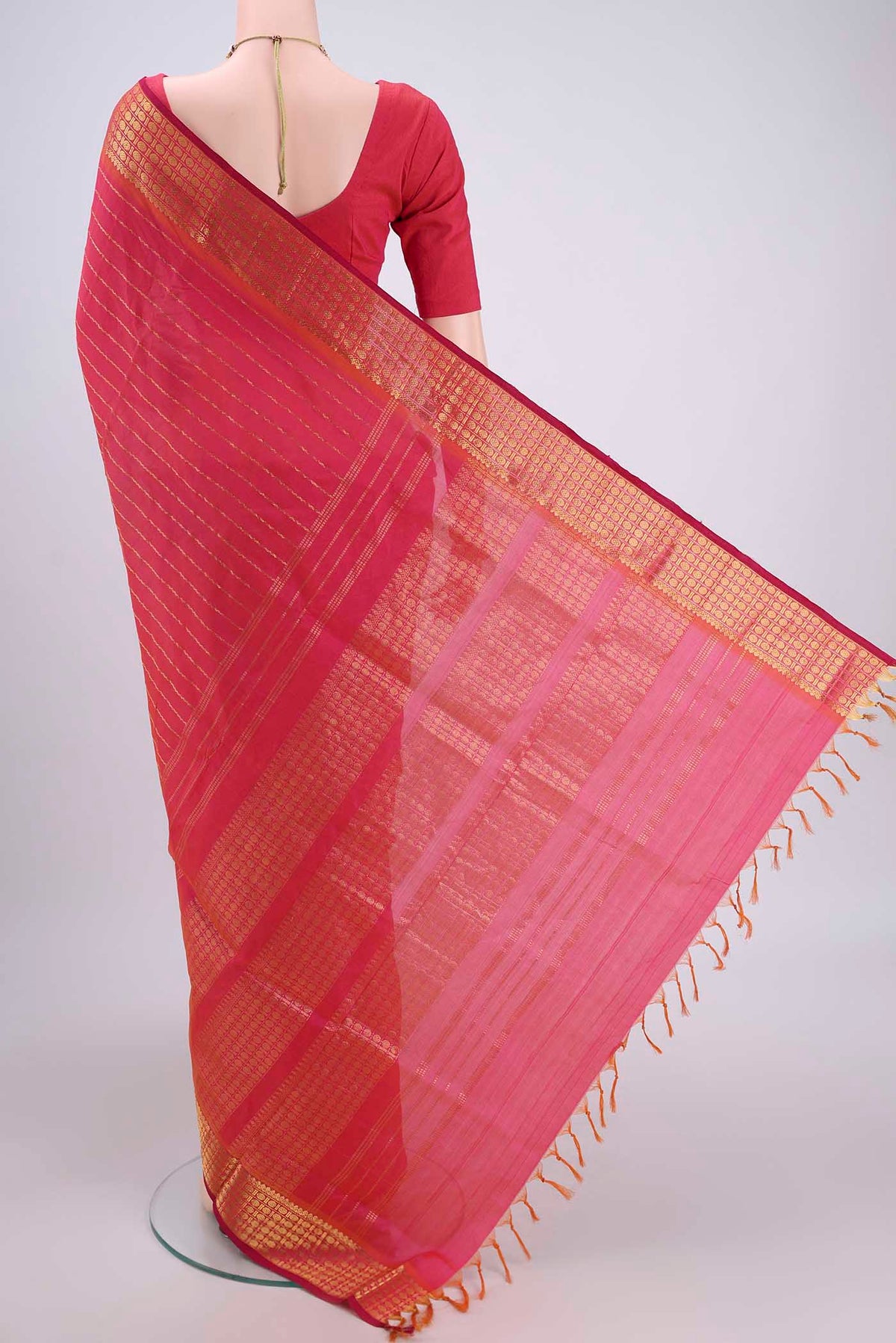 Flat view of Pink Silk Cotton Saree with Stripes on the body and Plain Border. 