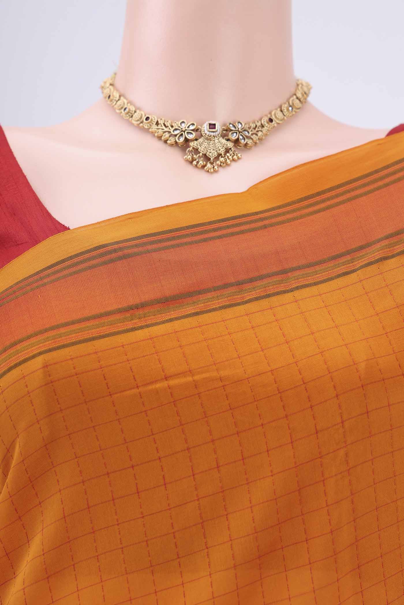 Border image of Mustard Blended Poly Cotton Saree with Checked design on the body and Thread Border. 