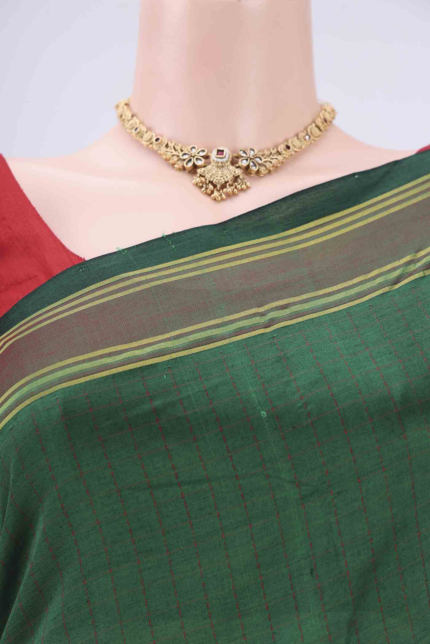 Border image of Green Blended Poly Cotton Saree with Checked design on the body and Thread Border. 