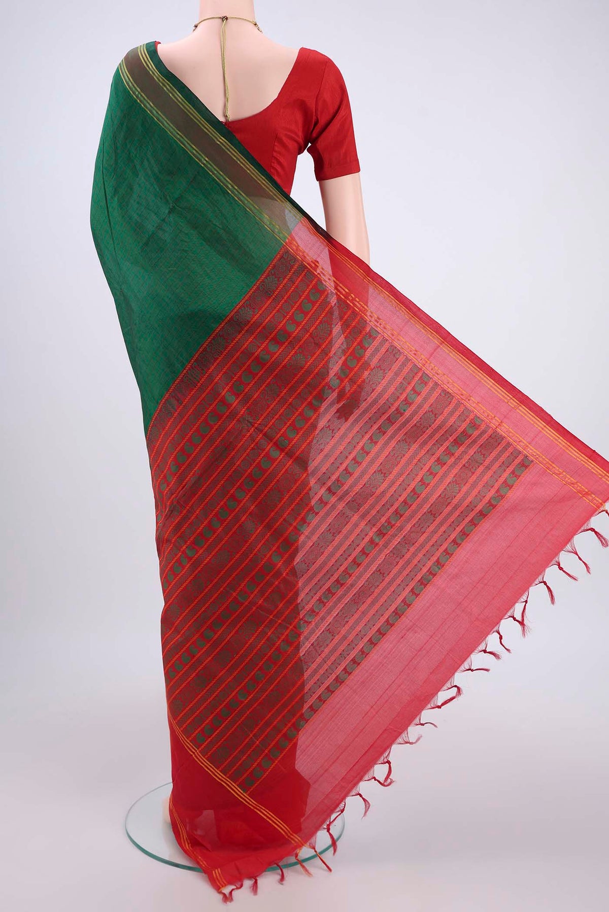Flat view of Green Blended Poly Cotton Saree with Checked design on the body and Thread Border. 