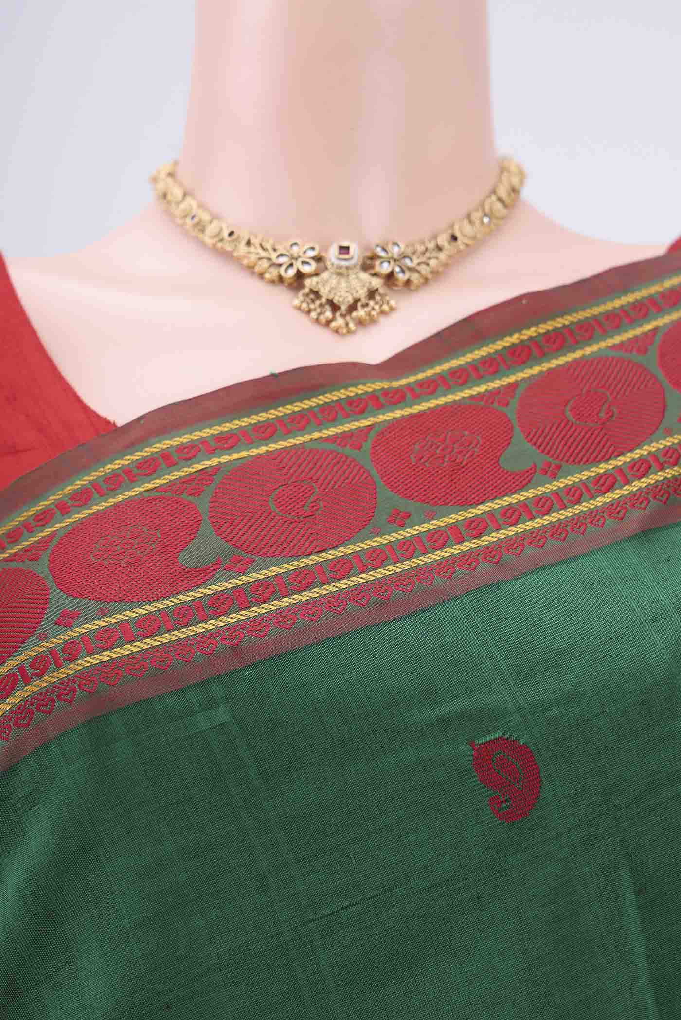 Border image of Green Blended Poly Cotton Saree with Thread Butta on the body and Thread Border. 