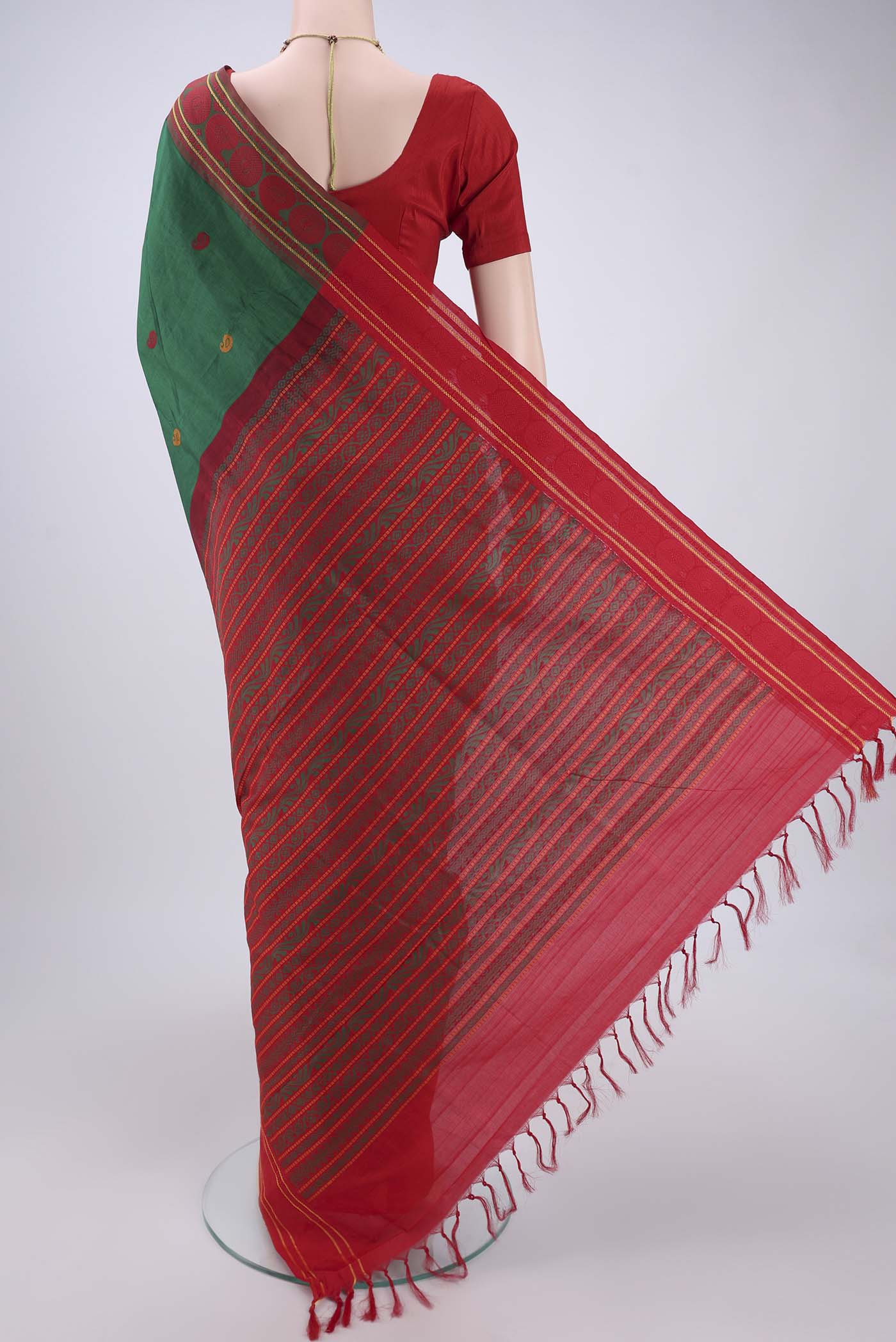 Flat view of Green Blended Poly Cotton Saree with Thread Butta on the body and Thread Border. 
