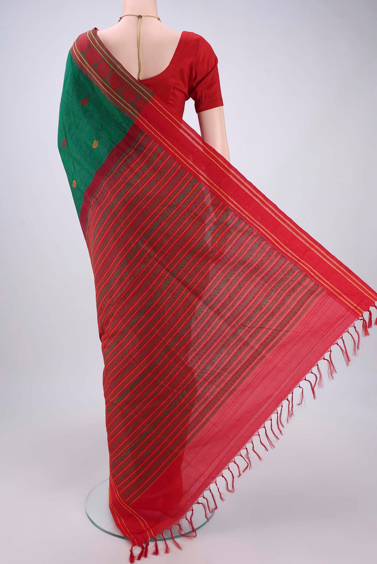Flat view of Green Blended Poly Cotton Saree with Thread Butta on the body and Thread Border. 