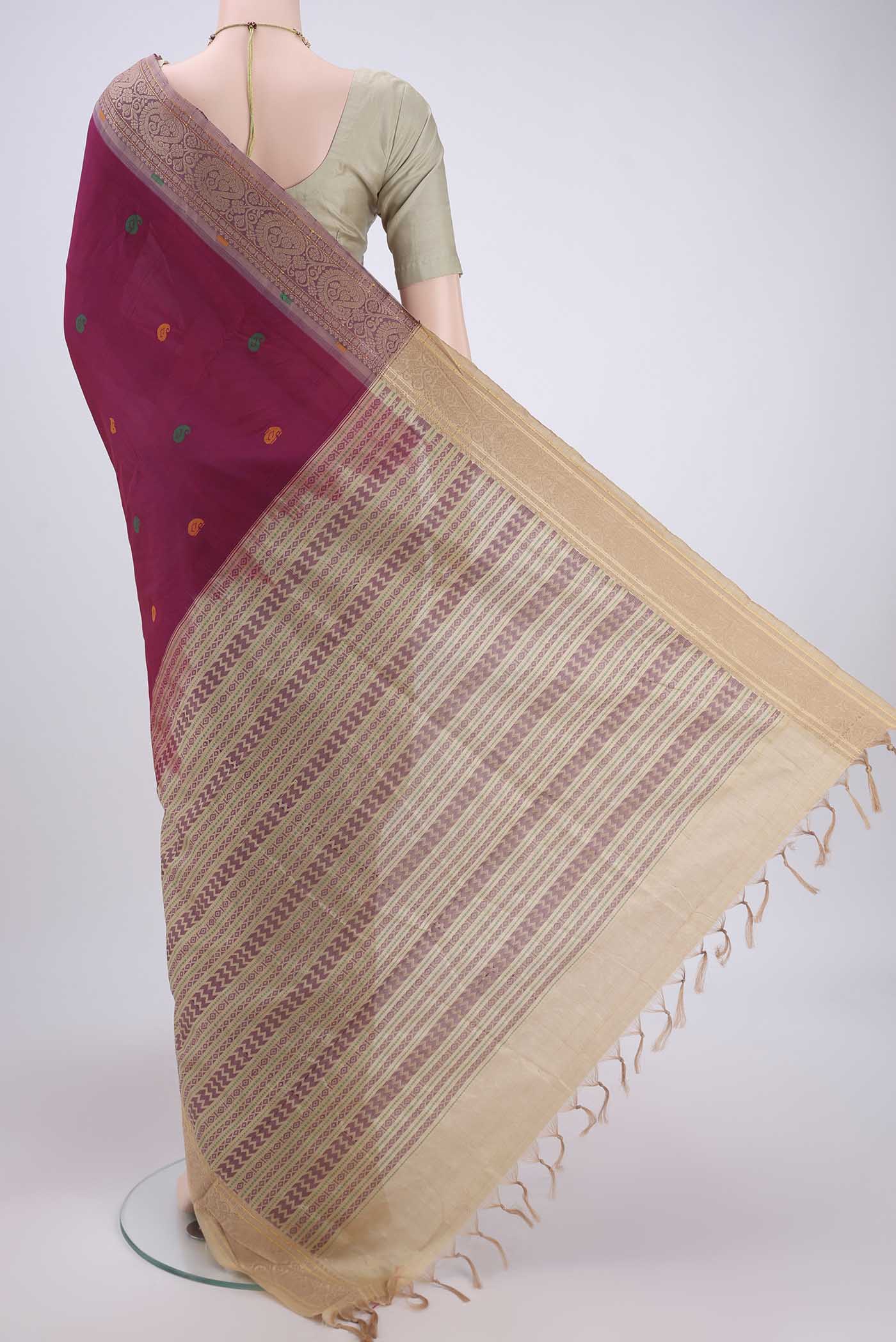 Flat view of Magenta Blended Poly Cotton Saree with Thread Butta on the body and Thread Border. 