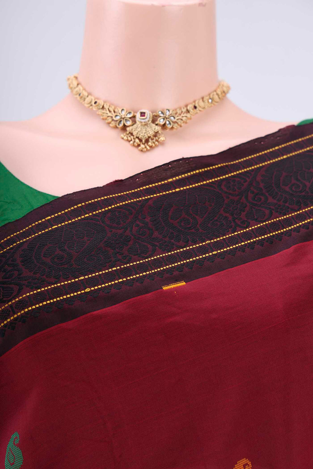 Border image of Maroon Blended Poly Cotton Saree with Thread Butta on the body and Thread Border. 