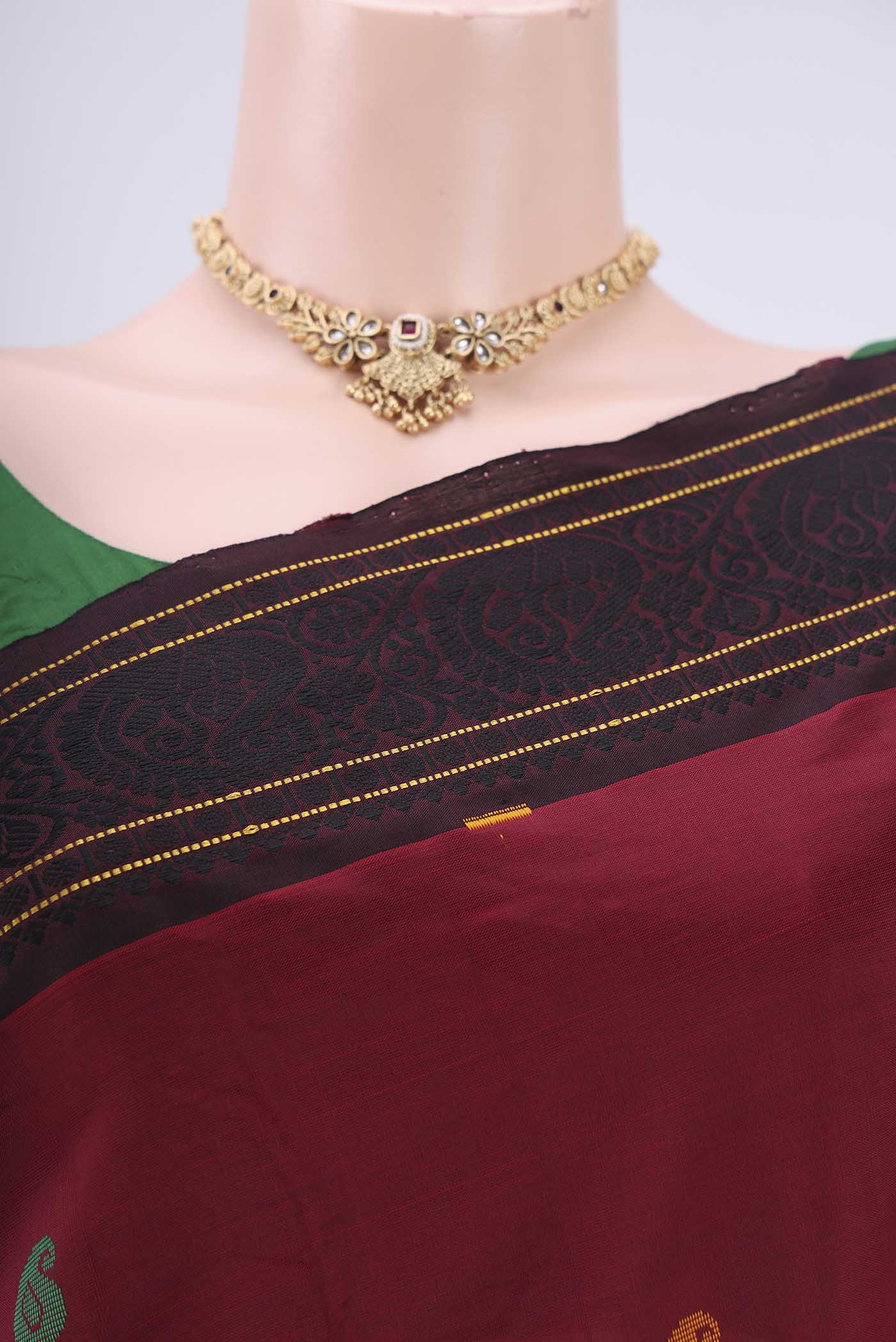 Border image of Maroon Blended Poly Cotton Saree with Thread Butta on the body and Thread Border. 
