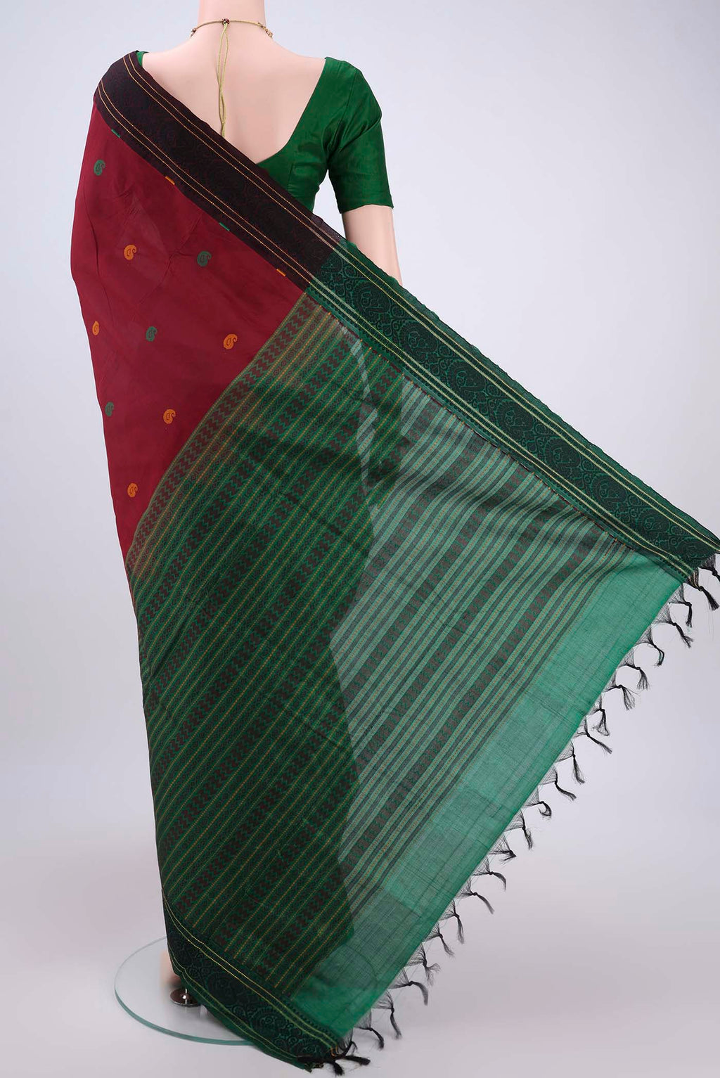 Flat view of Maroon Blended Poly Cotton Saree with Thread Butta on the body and Thread Border. 