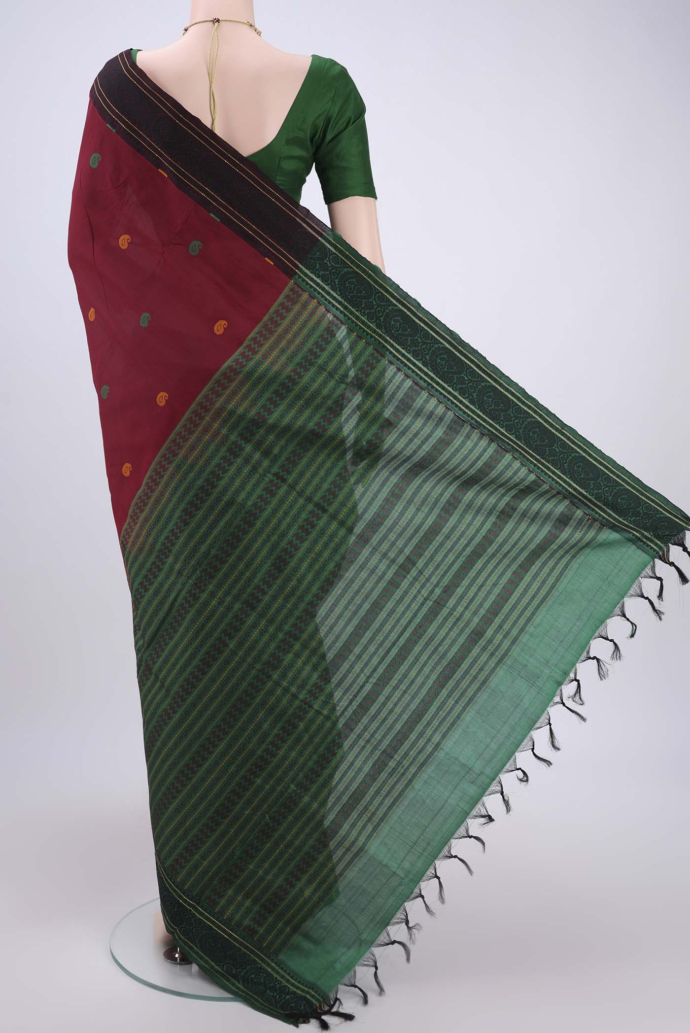 Flat view of Maroon Blended Poly Cotton Saree with Thread Butta on the body and Thread Border. 