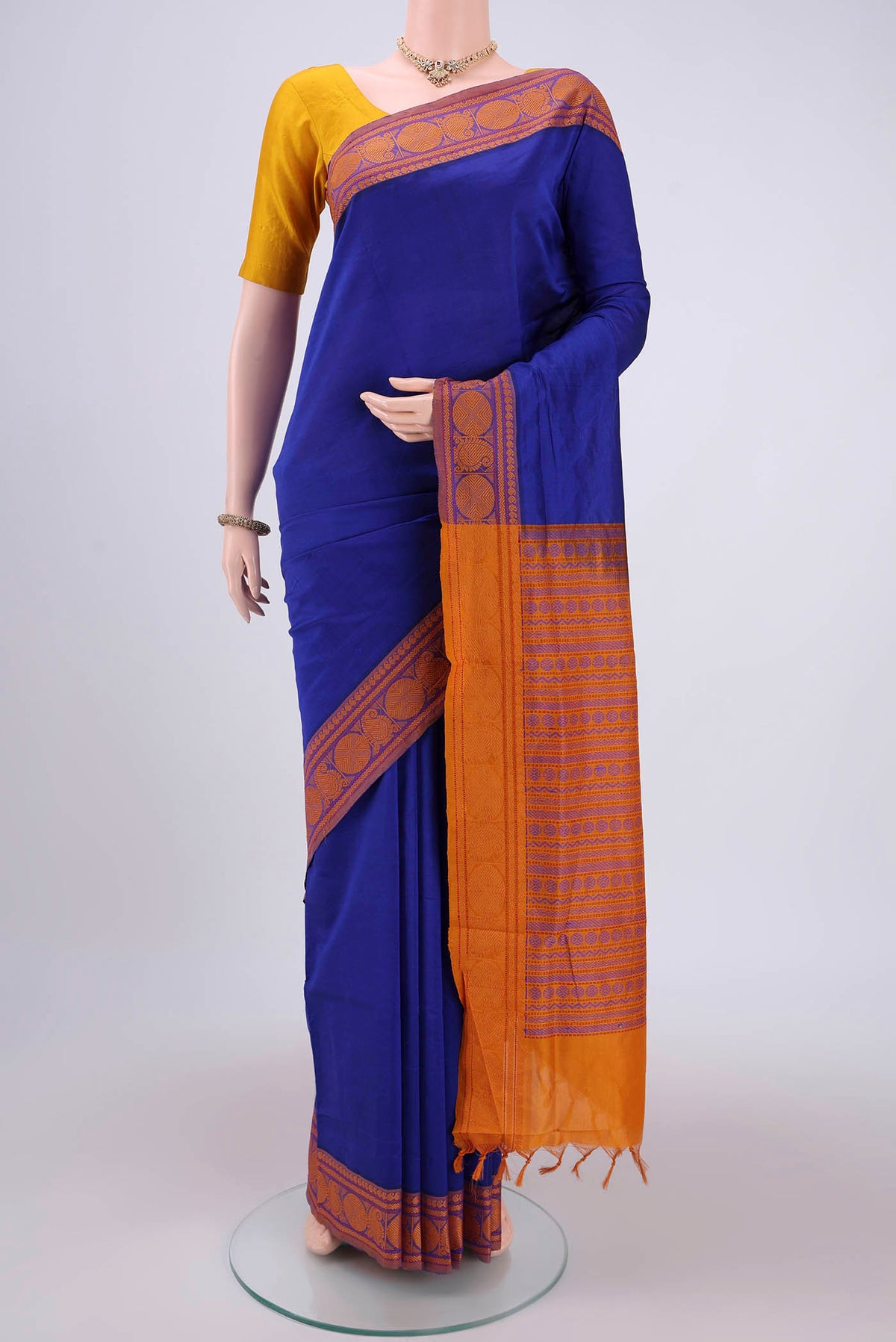 Royal Blue Blended Poly Cotton Saree with Plain Body and Thread Border.  displayed on a mannequin